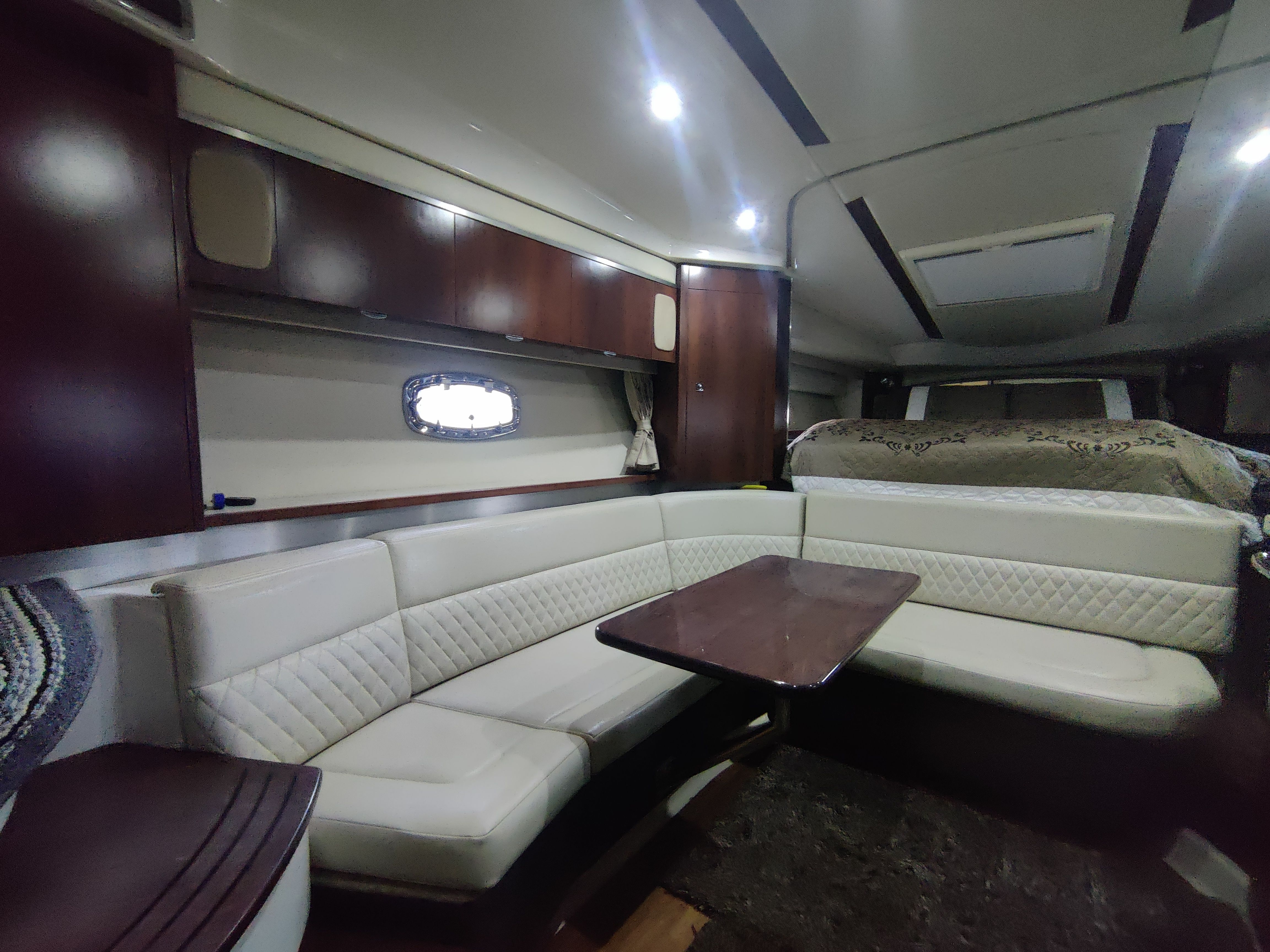 Interior of 2014 Chaparral 330 Signature yacht with elegant seating area.