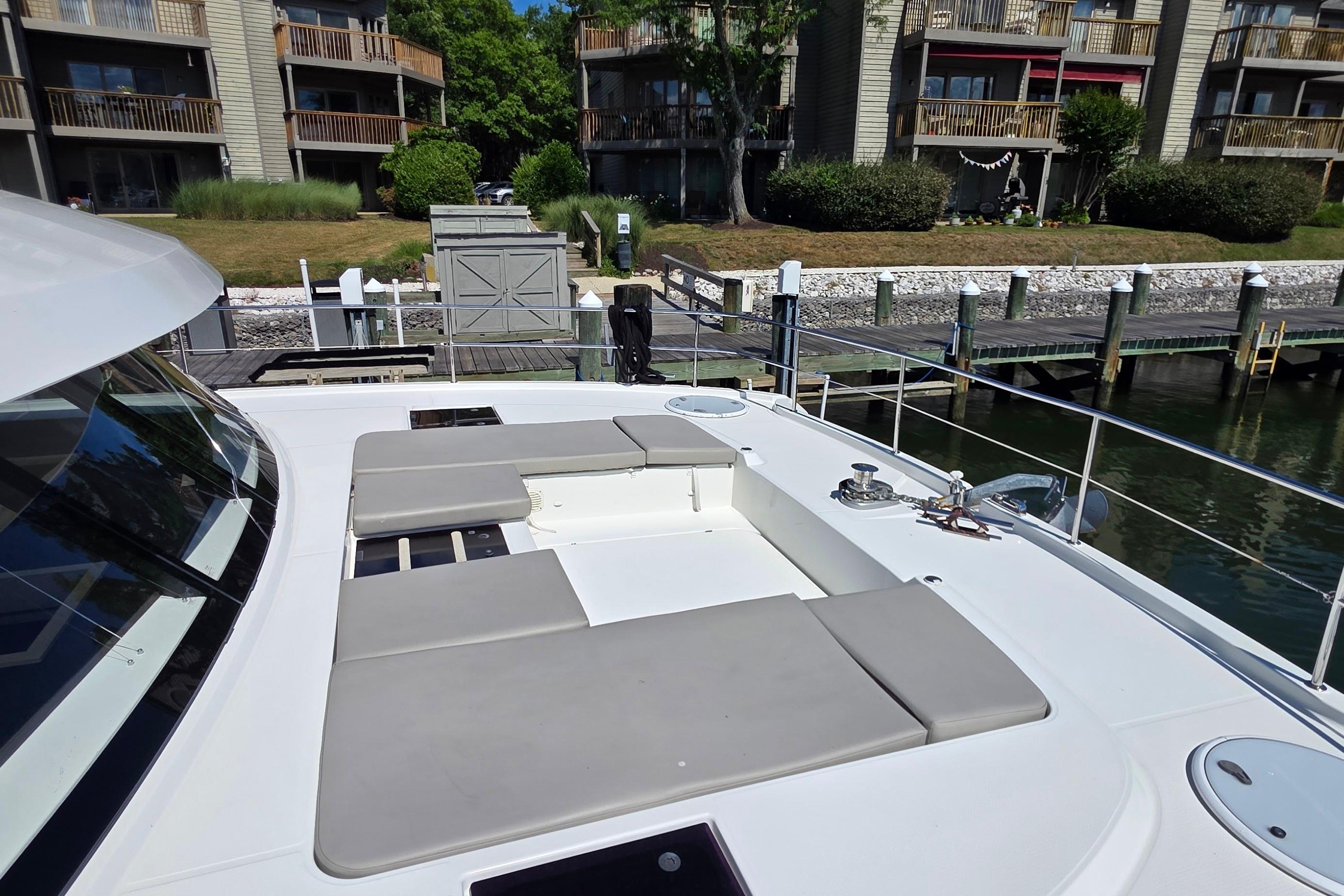 2018 Fountaine Pajot Motor Yacht 44 docked, featuring spacious deck with cushioned seating.