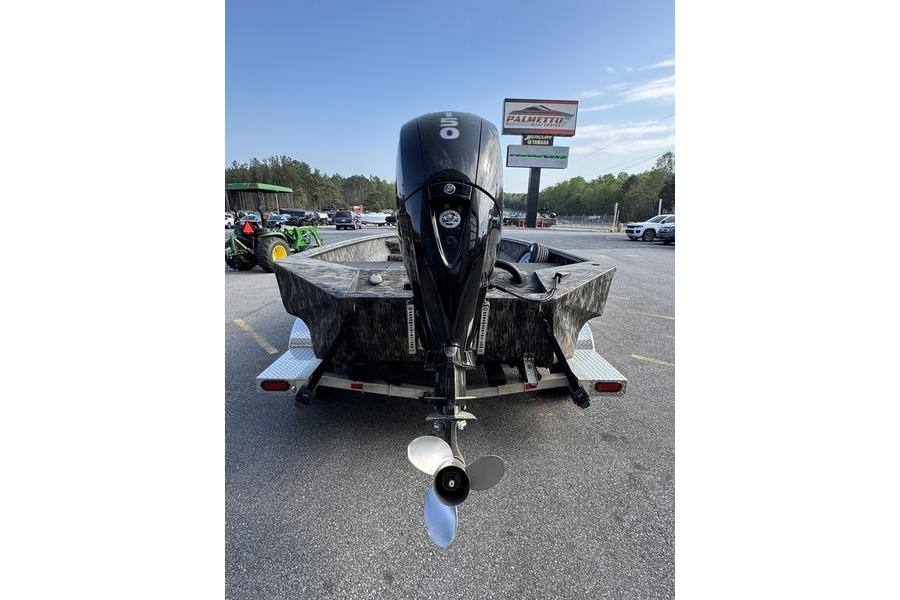 2023 Havoc 1756 MRST boat on trailer, rear view with outboard motor.