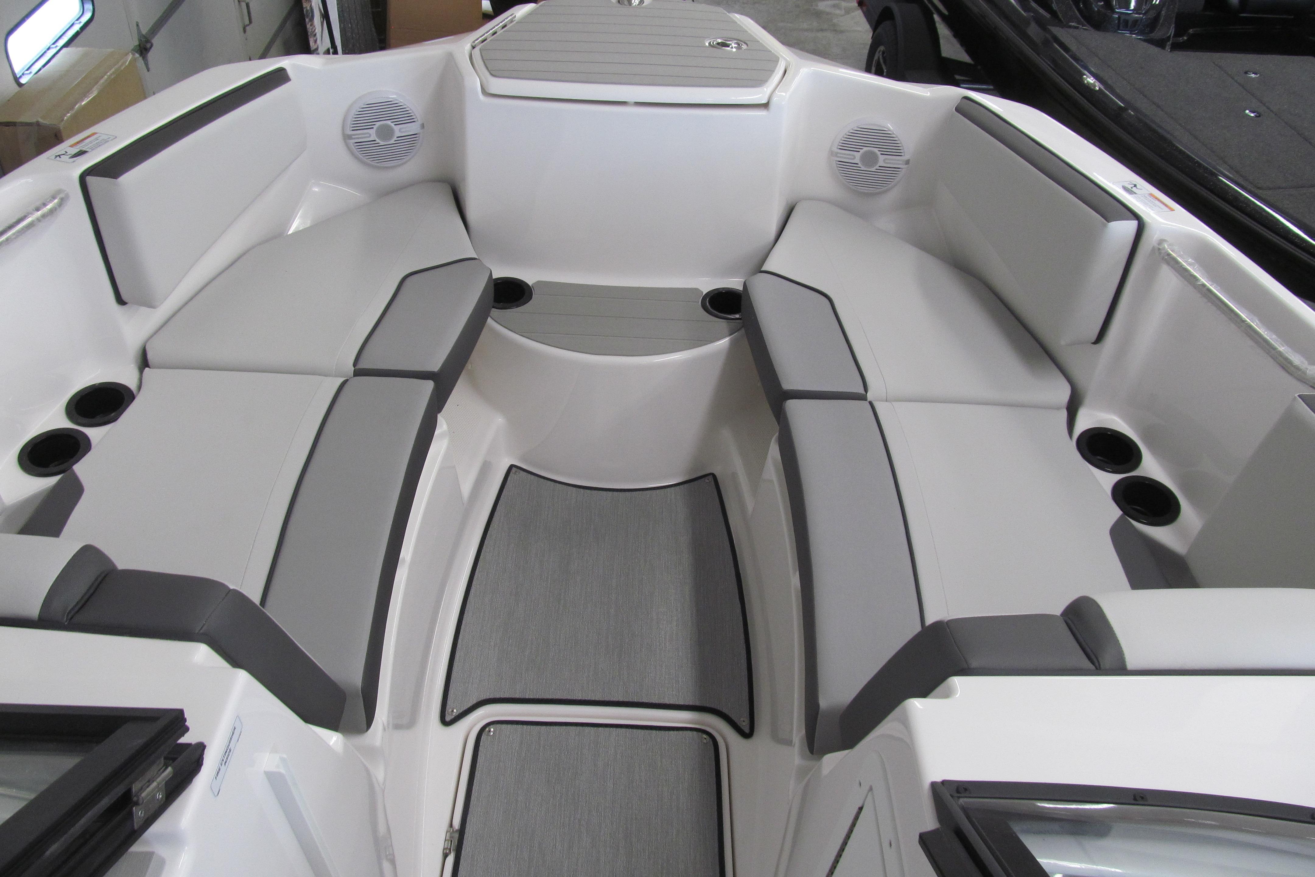 2026 Yamaha Boats AR220 interior with gray seating and cup holders.