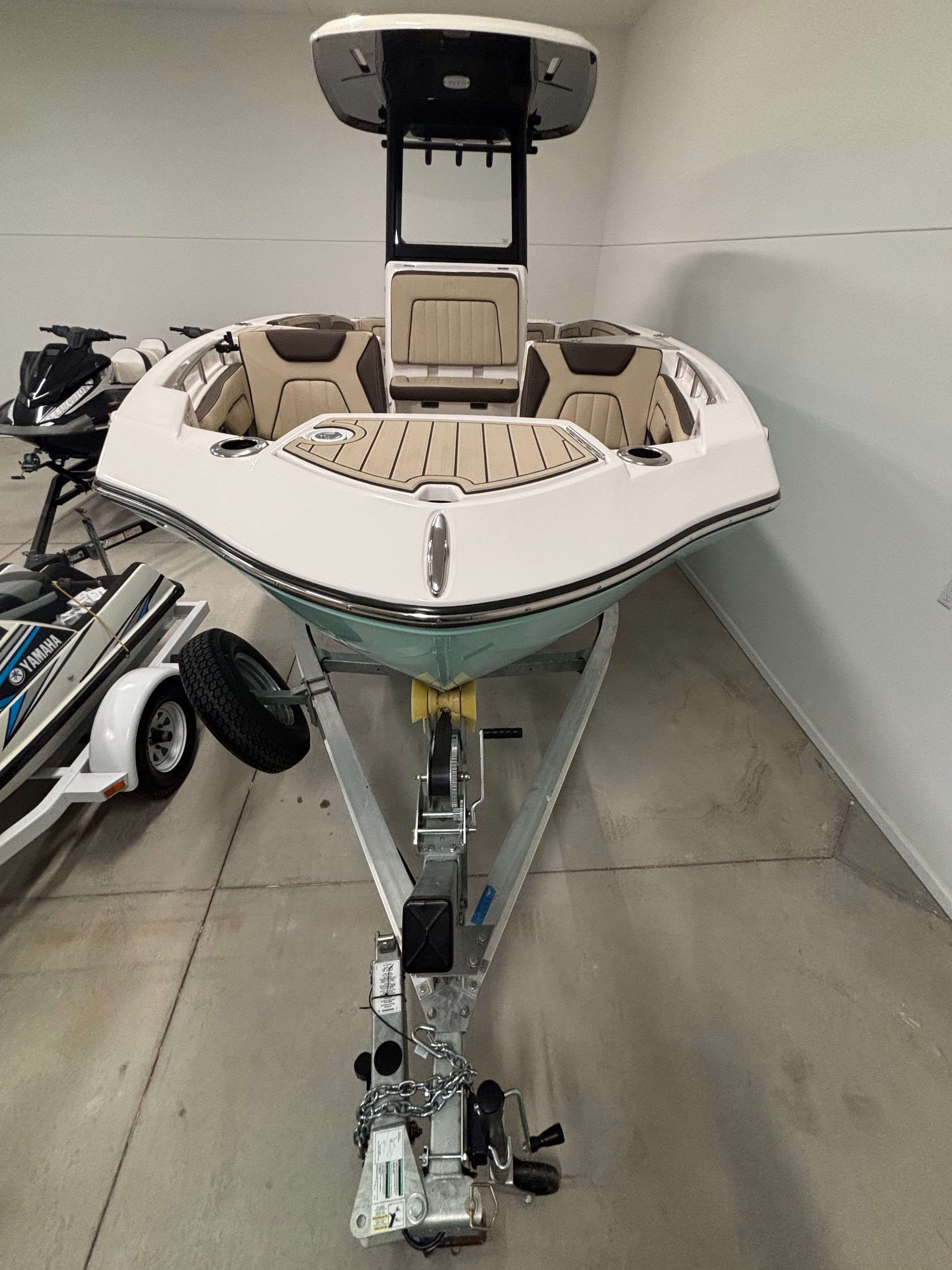 Yamaha 222 FSH Sport E from 2025 on a trailer in an indoor setting.