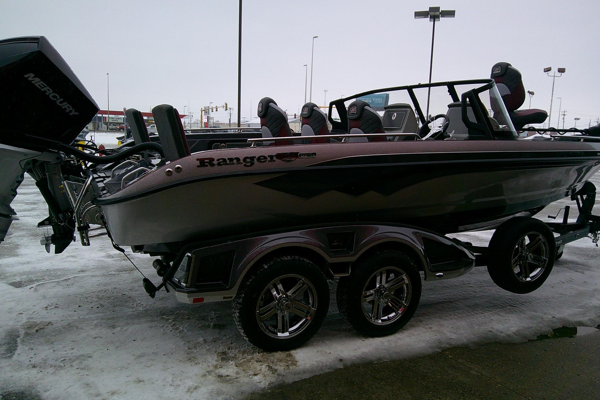 2026 Ranger 620xFS Pro boat on trailer in snowy parking lot.