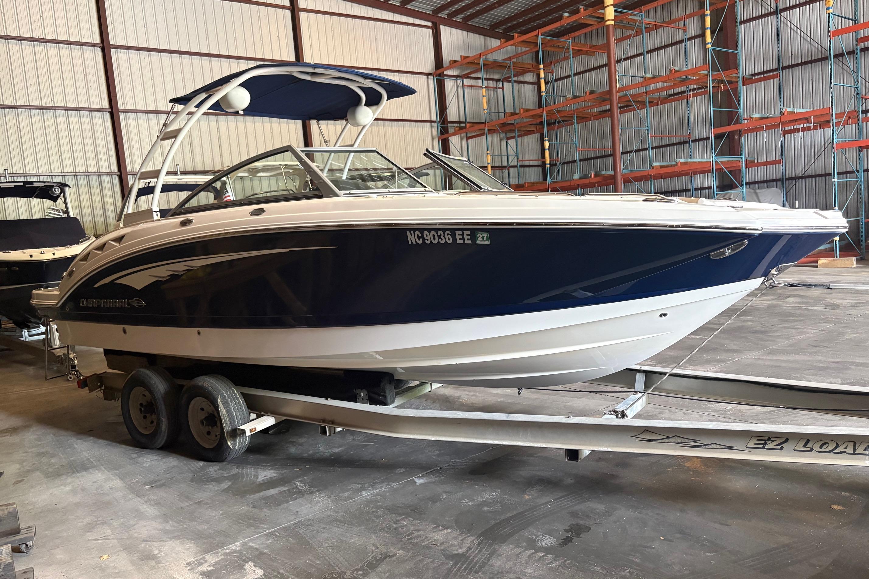 2016 Chaparral 244 Sunesta boat on trailer in storage facility.