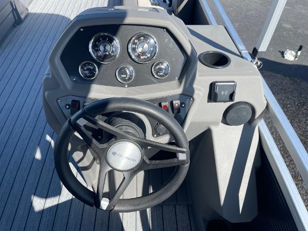 Steering console of 2025 Armada Saphir 23CR boat with gauges and controls.