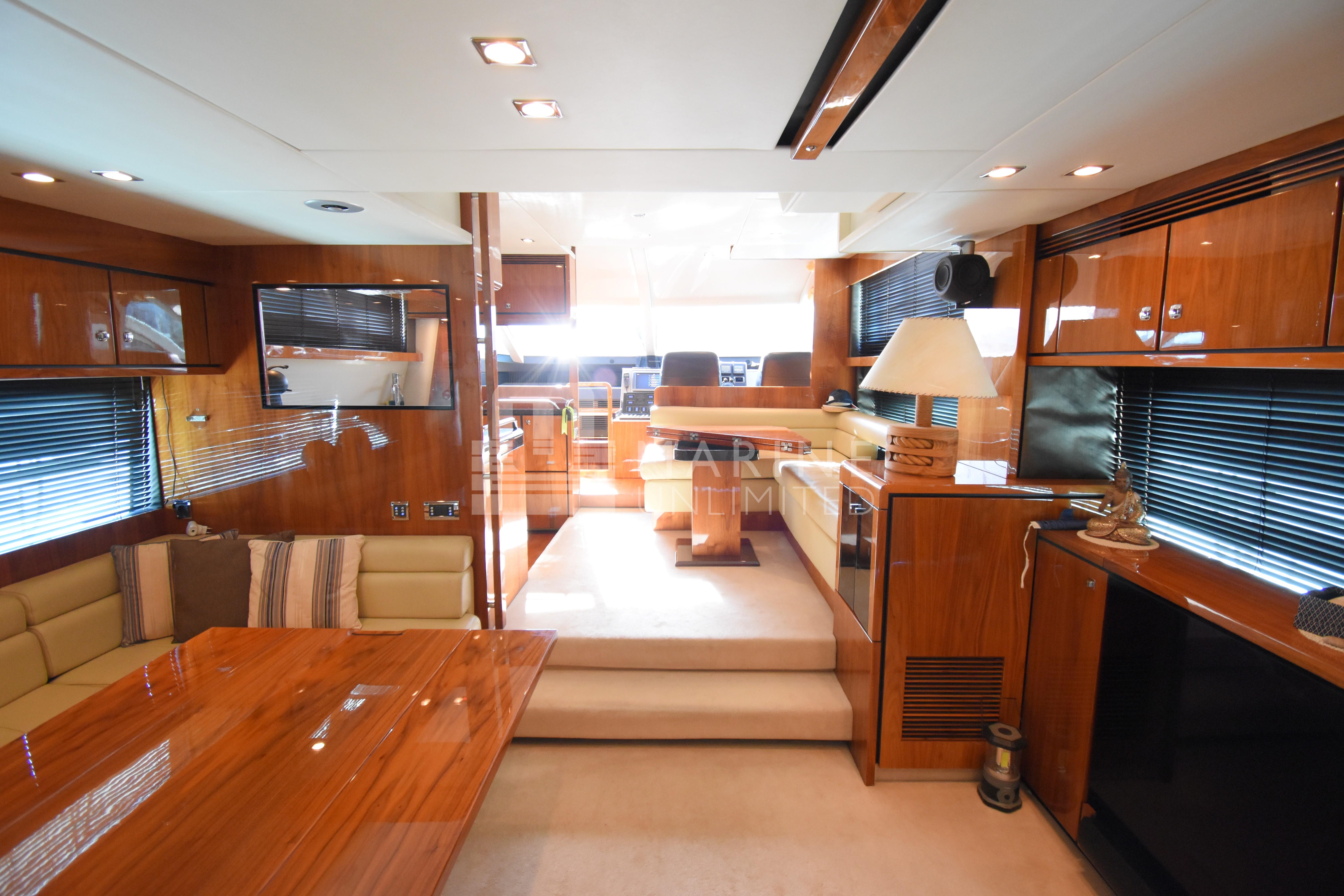 Luxurious interior of 2010 Fairline Squadron 55 yacht with polished wood finishes.