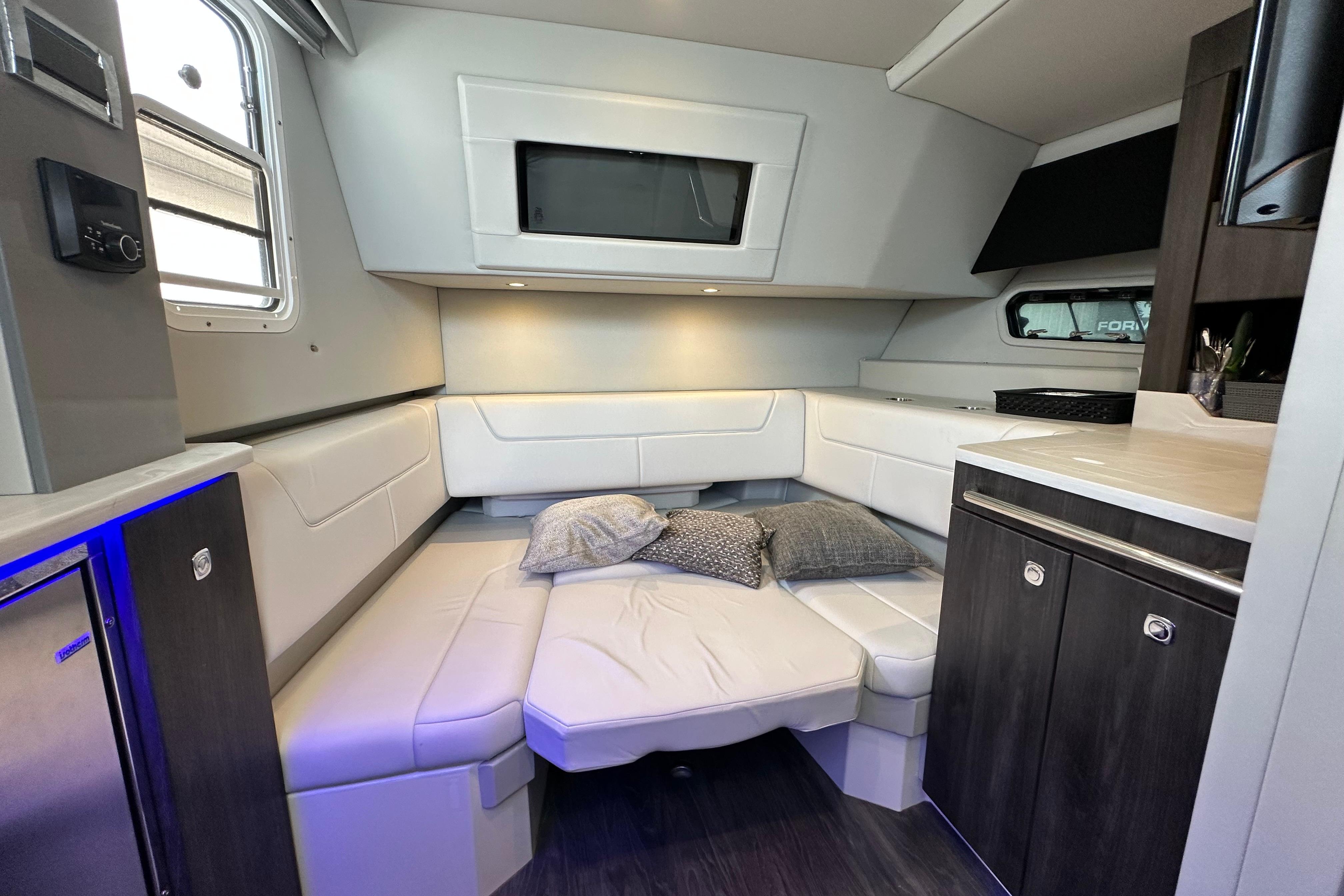 2021 Formula 380 Super Sport Crossover OB cabin interior with modern seating and cushions.