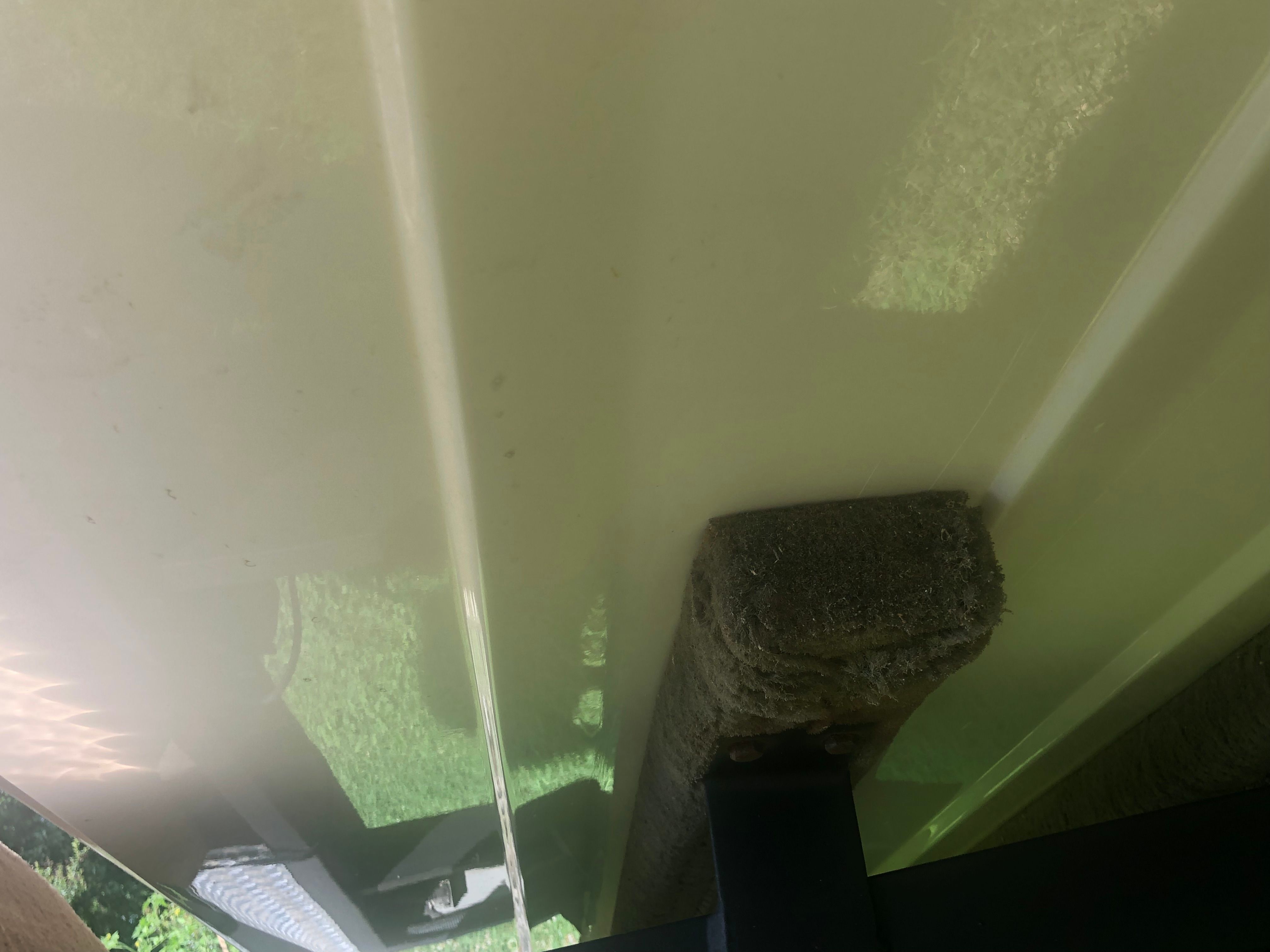 Underside of a boat on a trailer with padding.