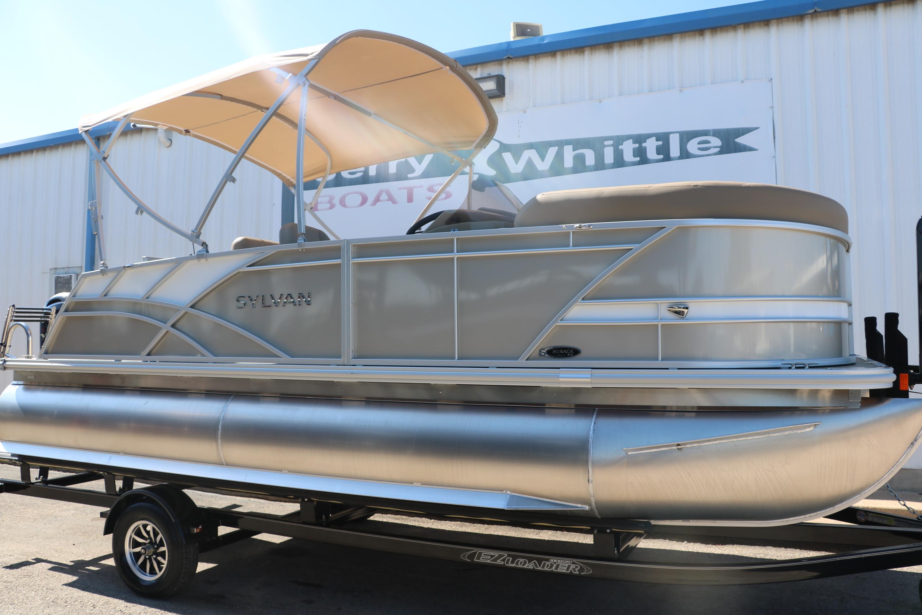 2025 Sylvan Mirage 820 CLZ DH pontoon boat on trailer, beige canopy, outdoor display.