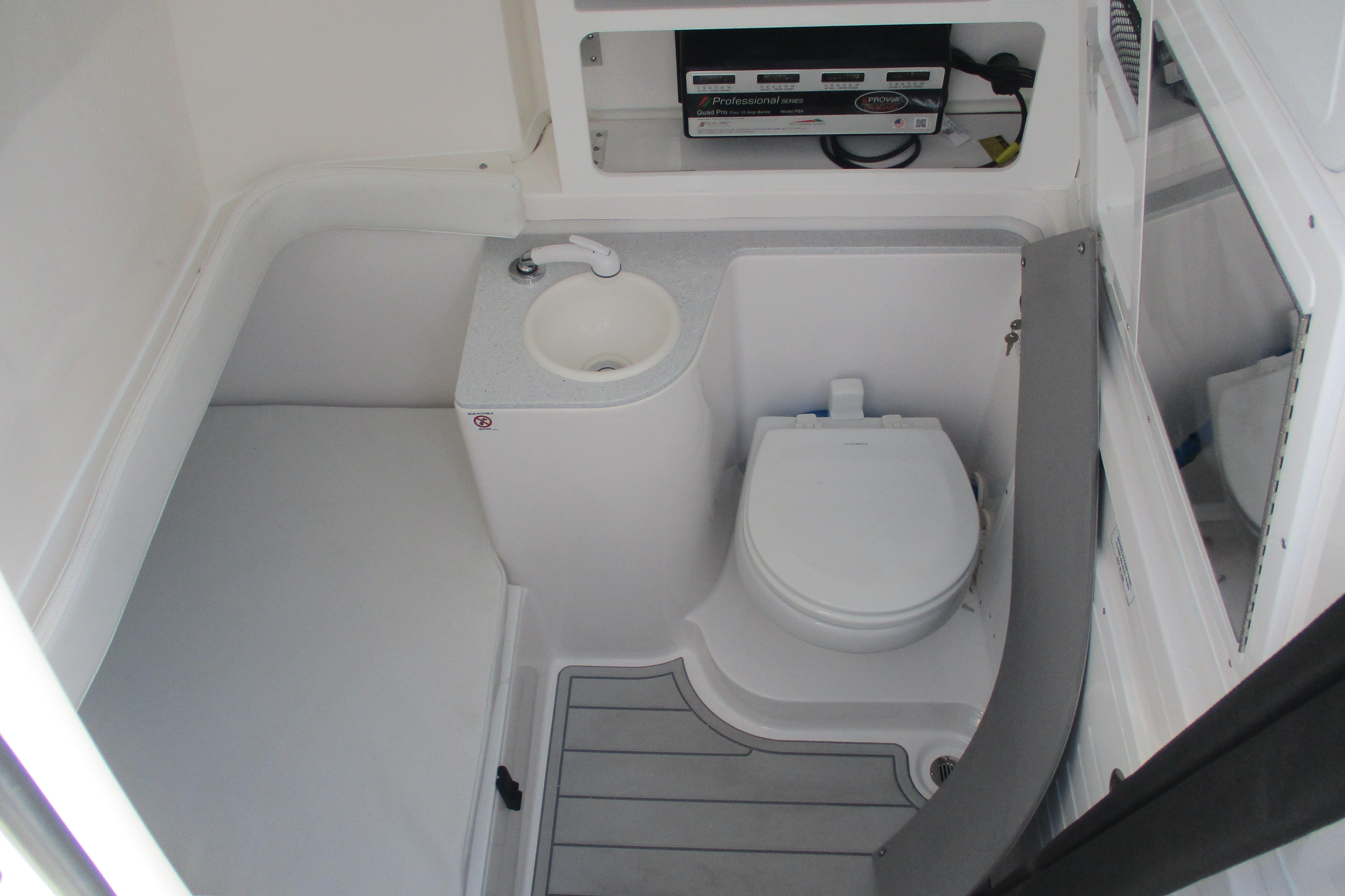 2026 Sea Fox 328 Commander boat bathroom with toilet and sink.