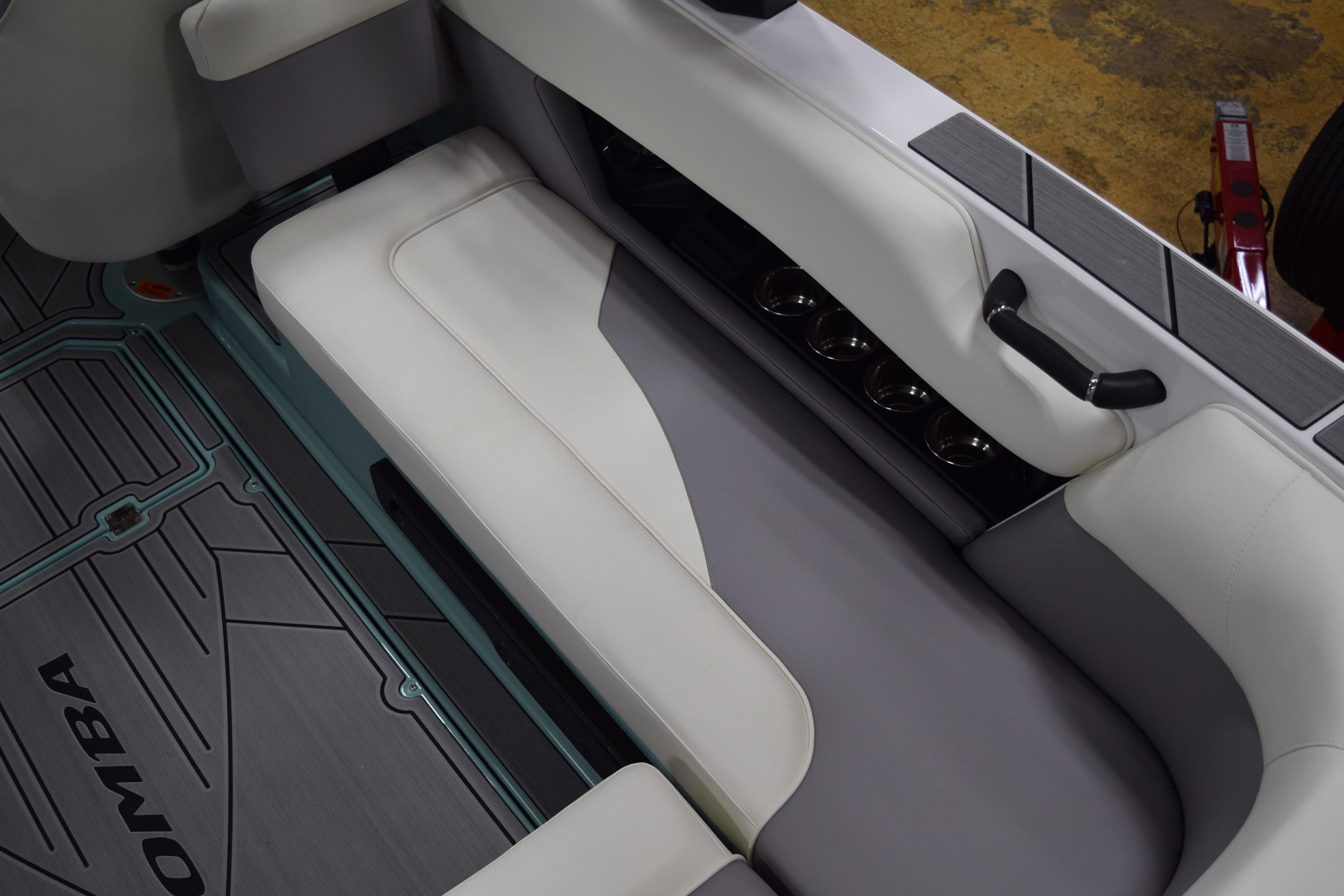 2025 Moomba Mojo boat interior with sleek seating and cup holders.