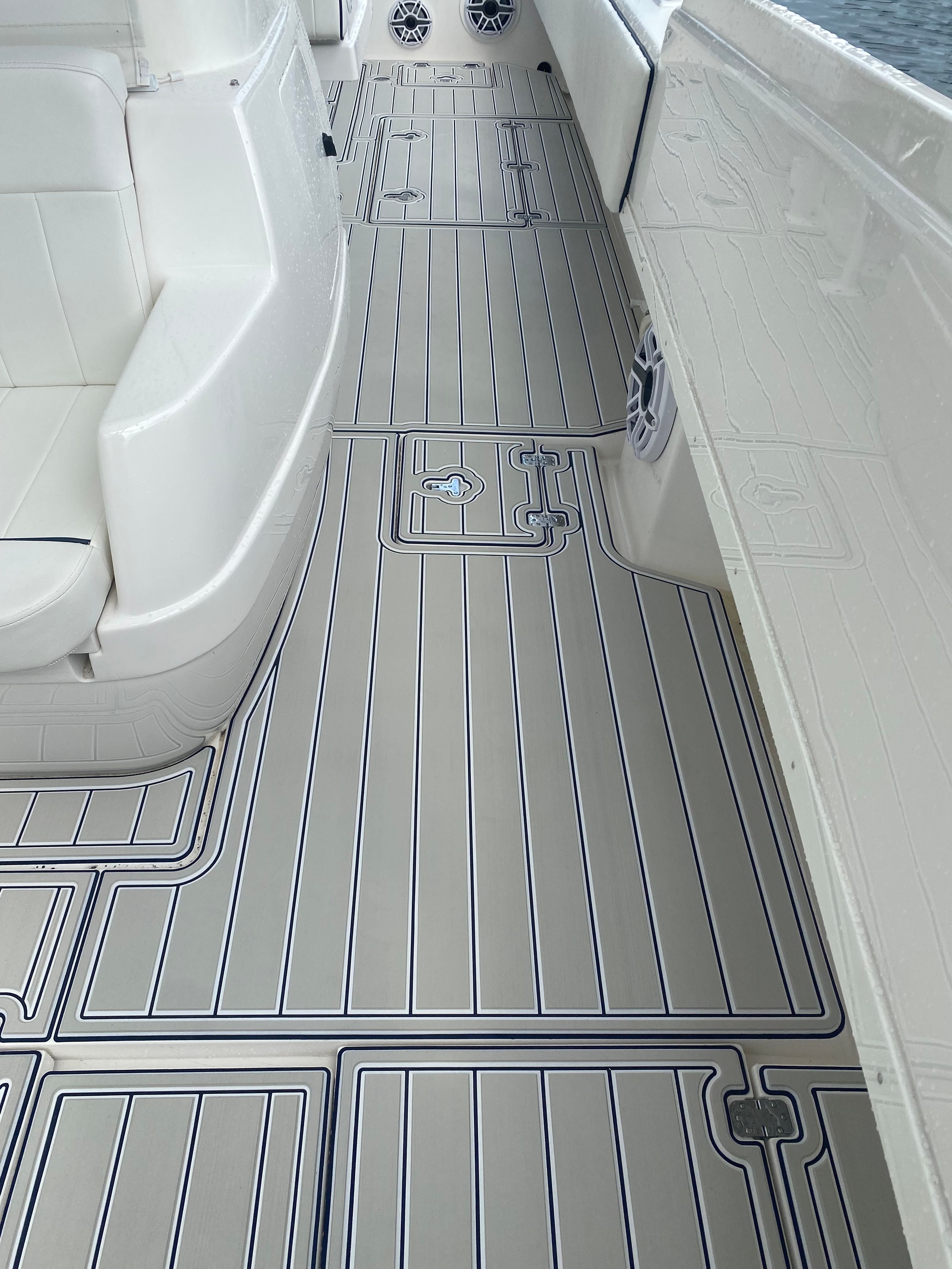 The image shows the deck of a 2011 Intrepid 37 boat with sleek lines.