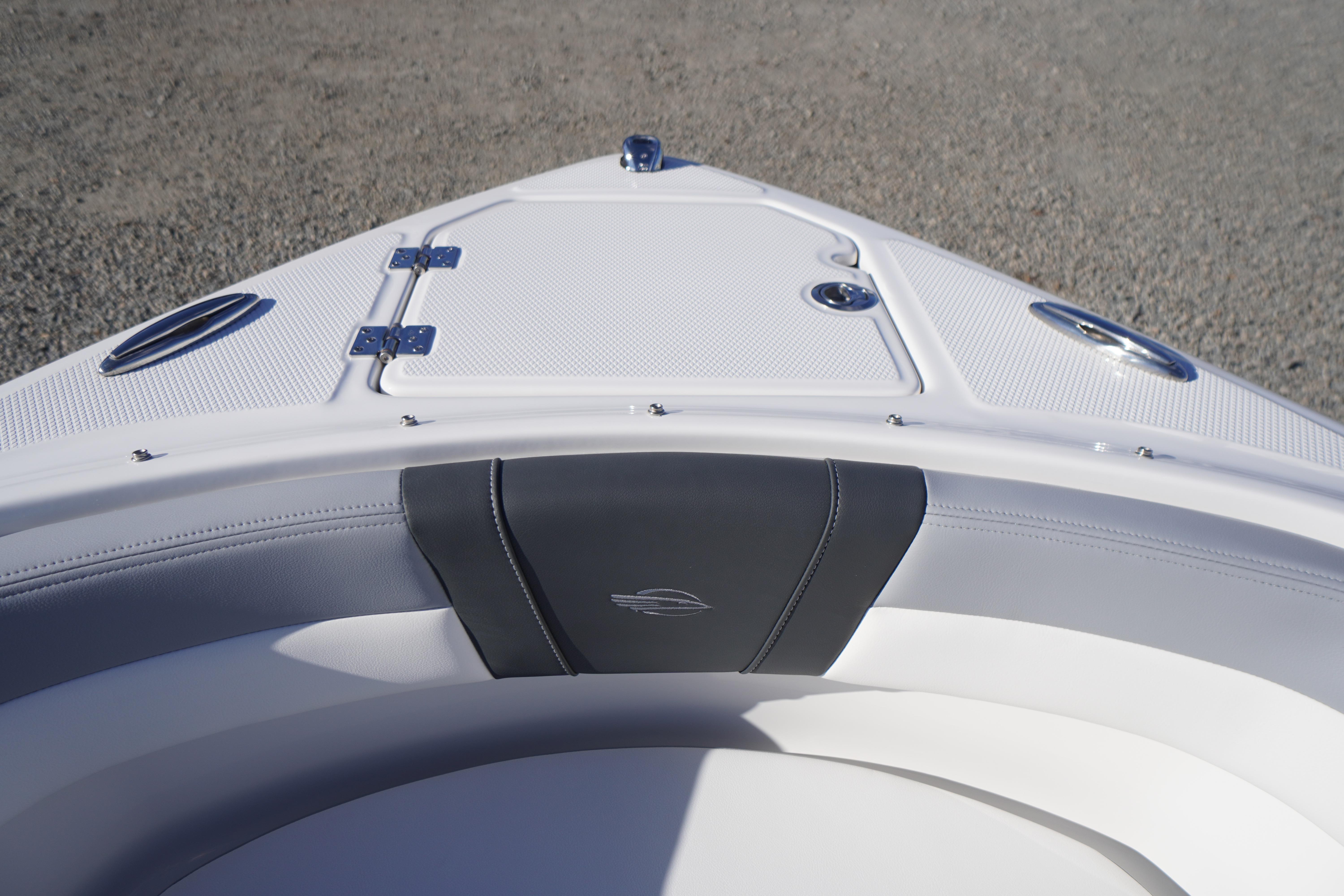 2026 Chaparral 23 SSi boat bow with sleek white and black seating design.