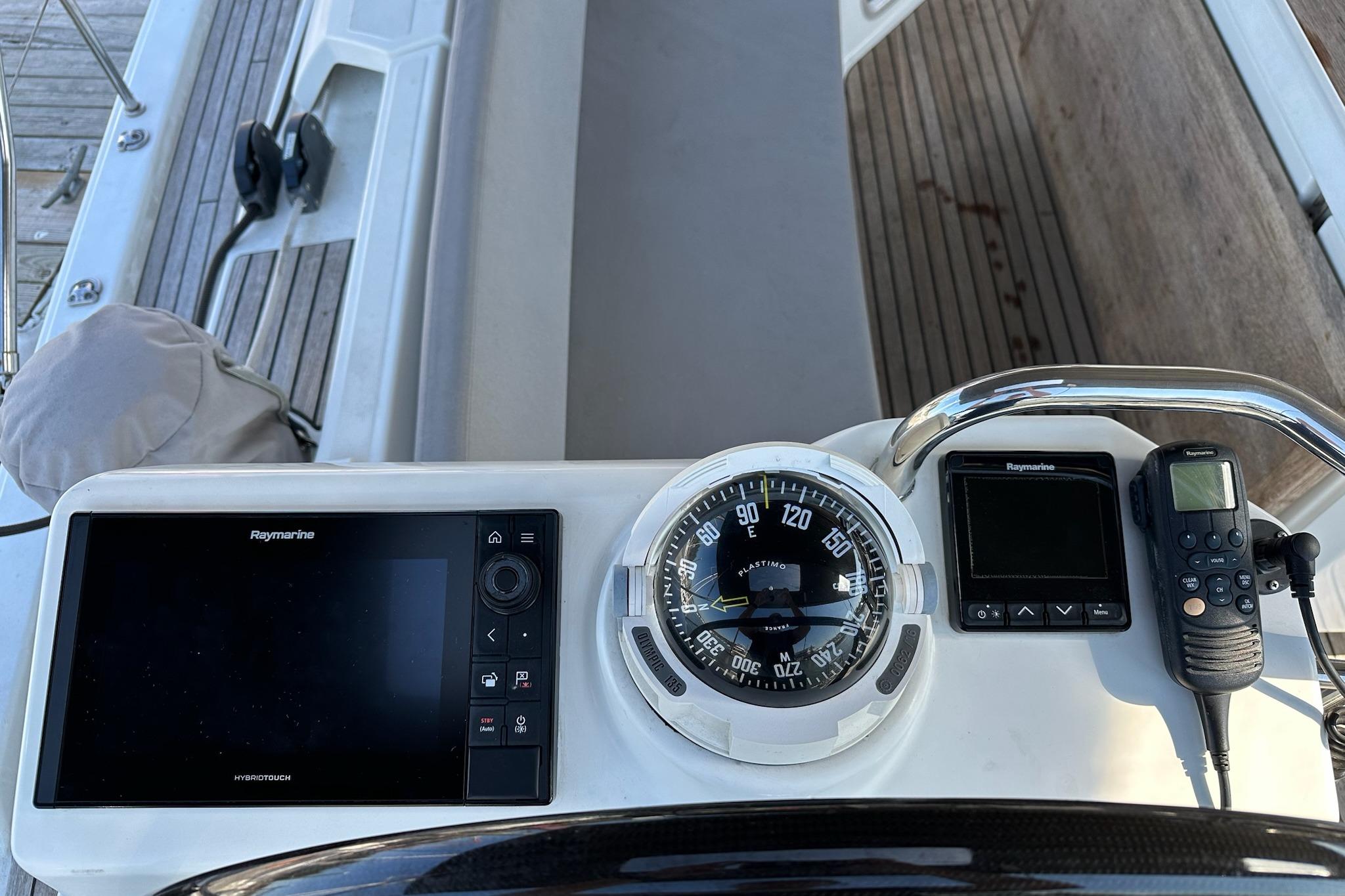 Cockpit of 2018 Jeanneau 51 yacht with navigation instruments and controls.