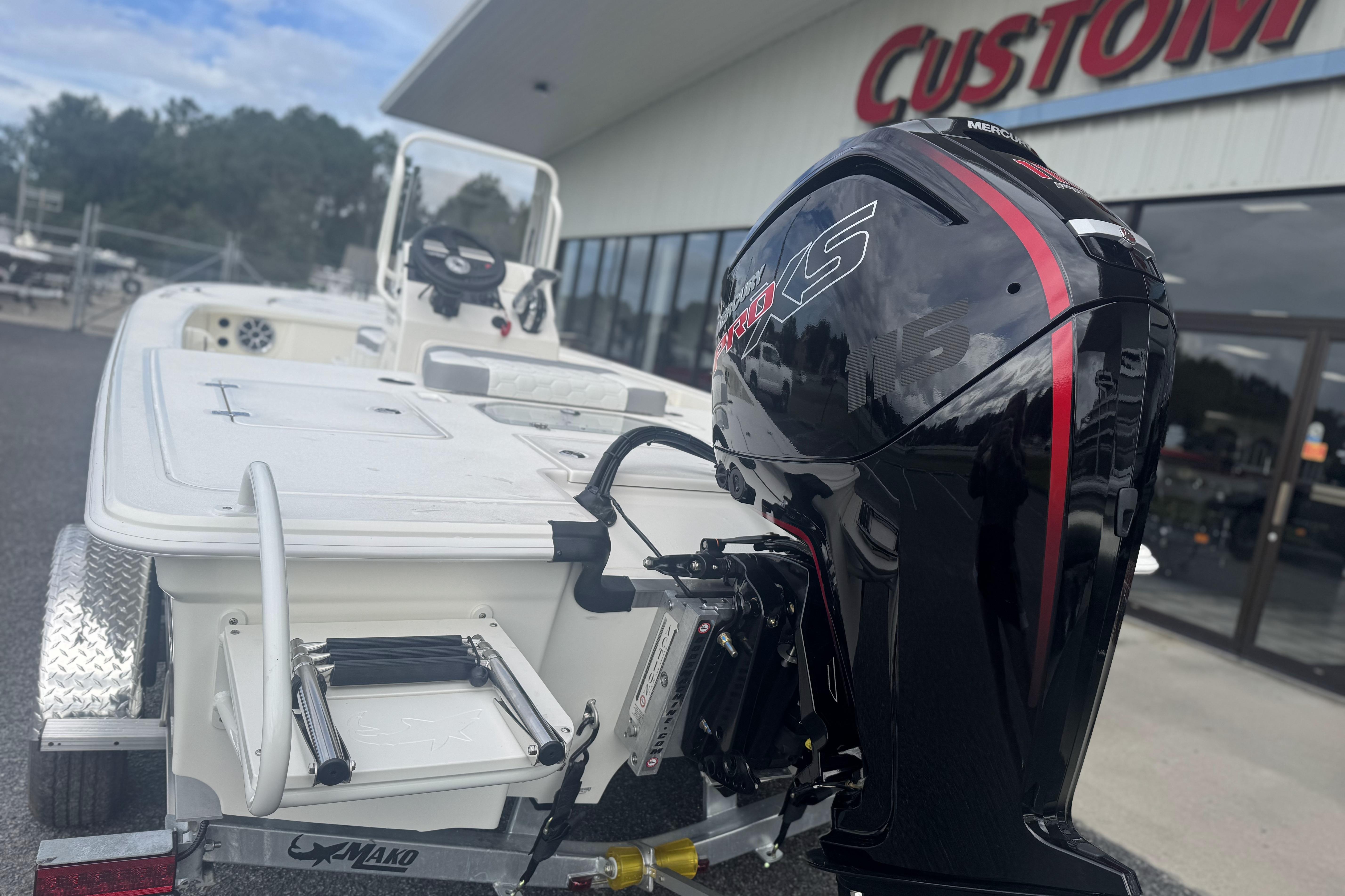 2026 Mako 18 Pro Skiff with powerful outboard motor at dealership.