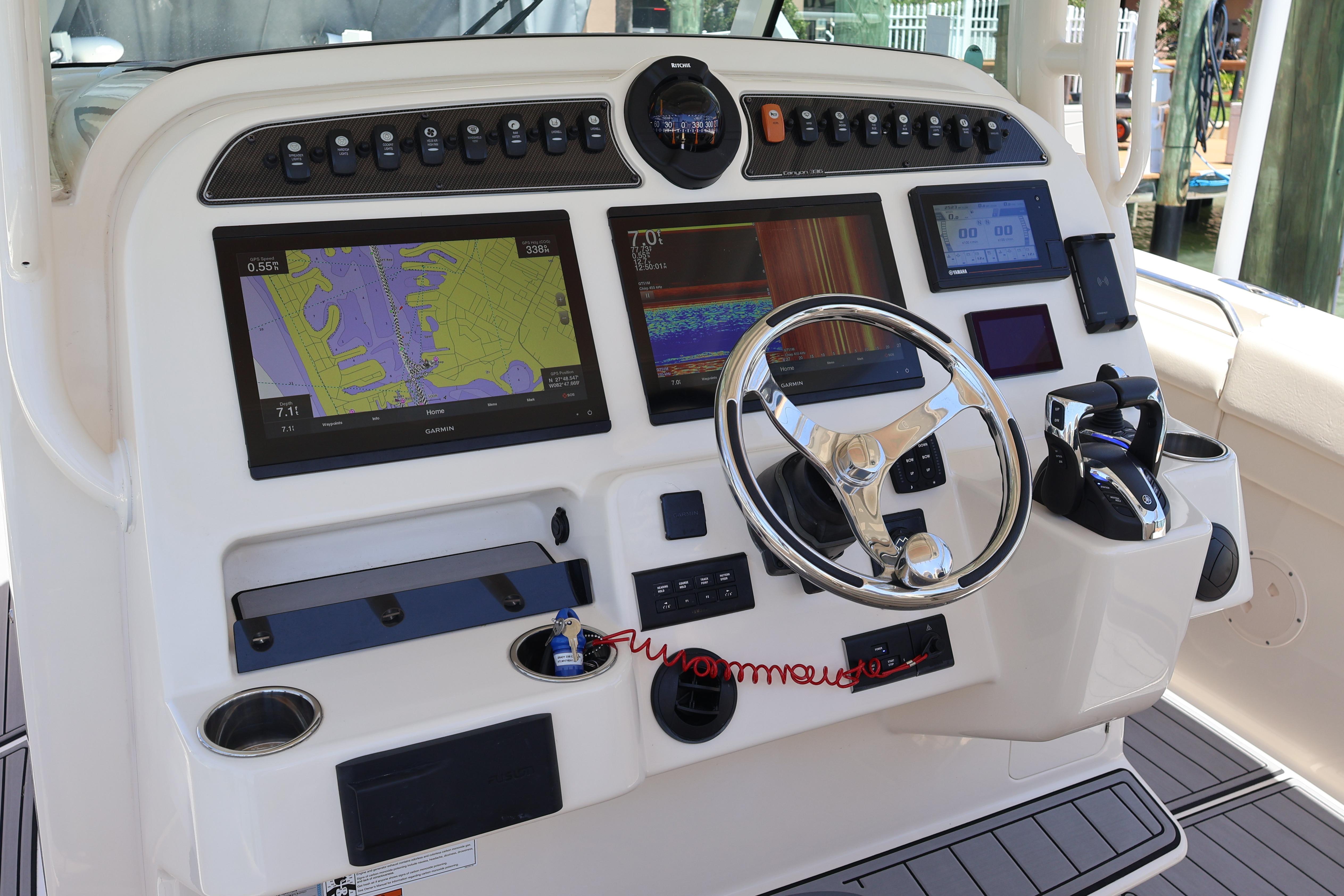 2021 Grady-White Canyon 336 helm with advanced navigation displays and controls.