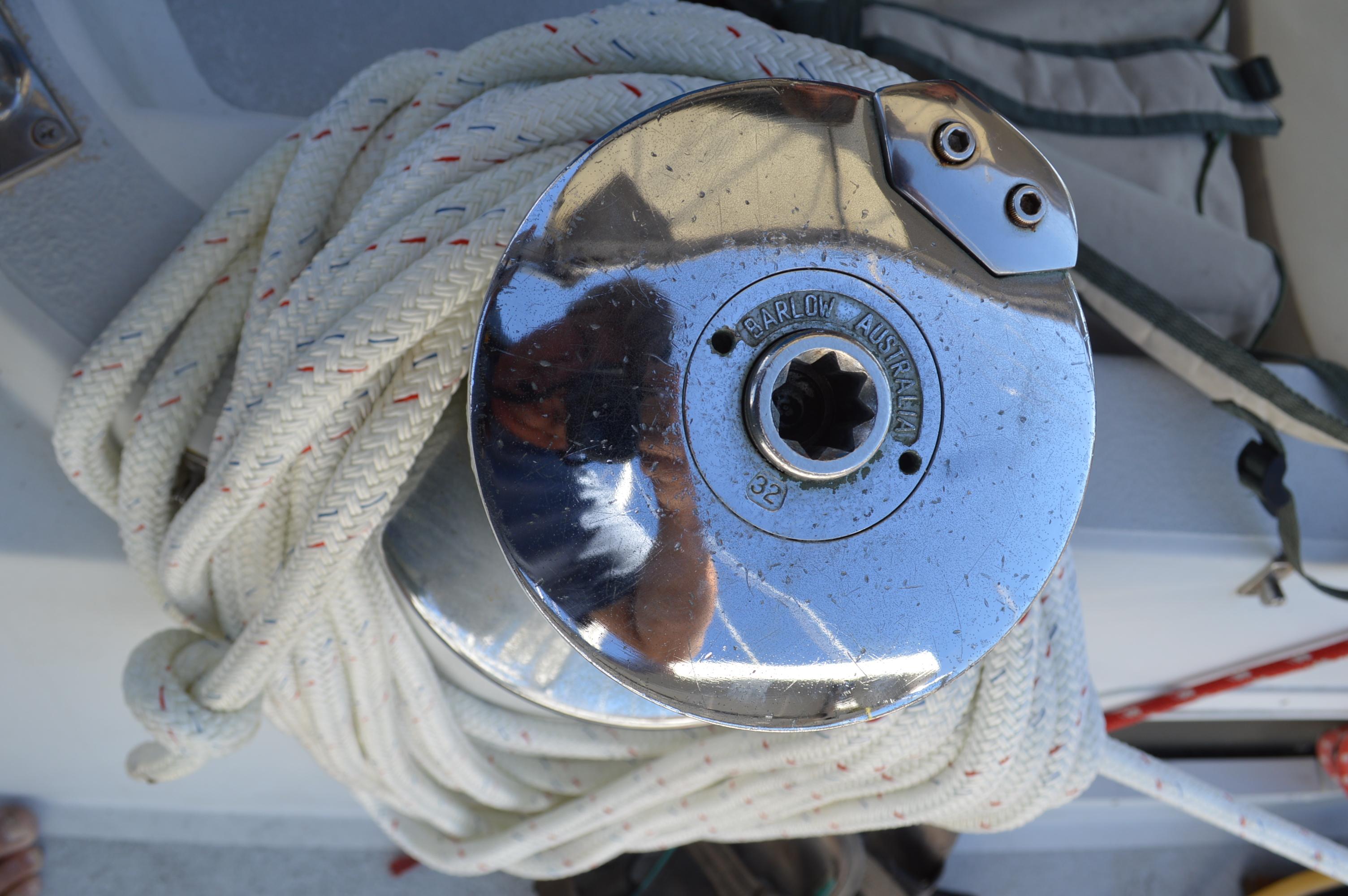 Chrome sailboat winch with coiled rope on a 1979 Morgan 461 yacht.