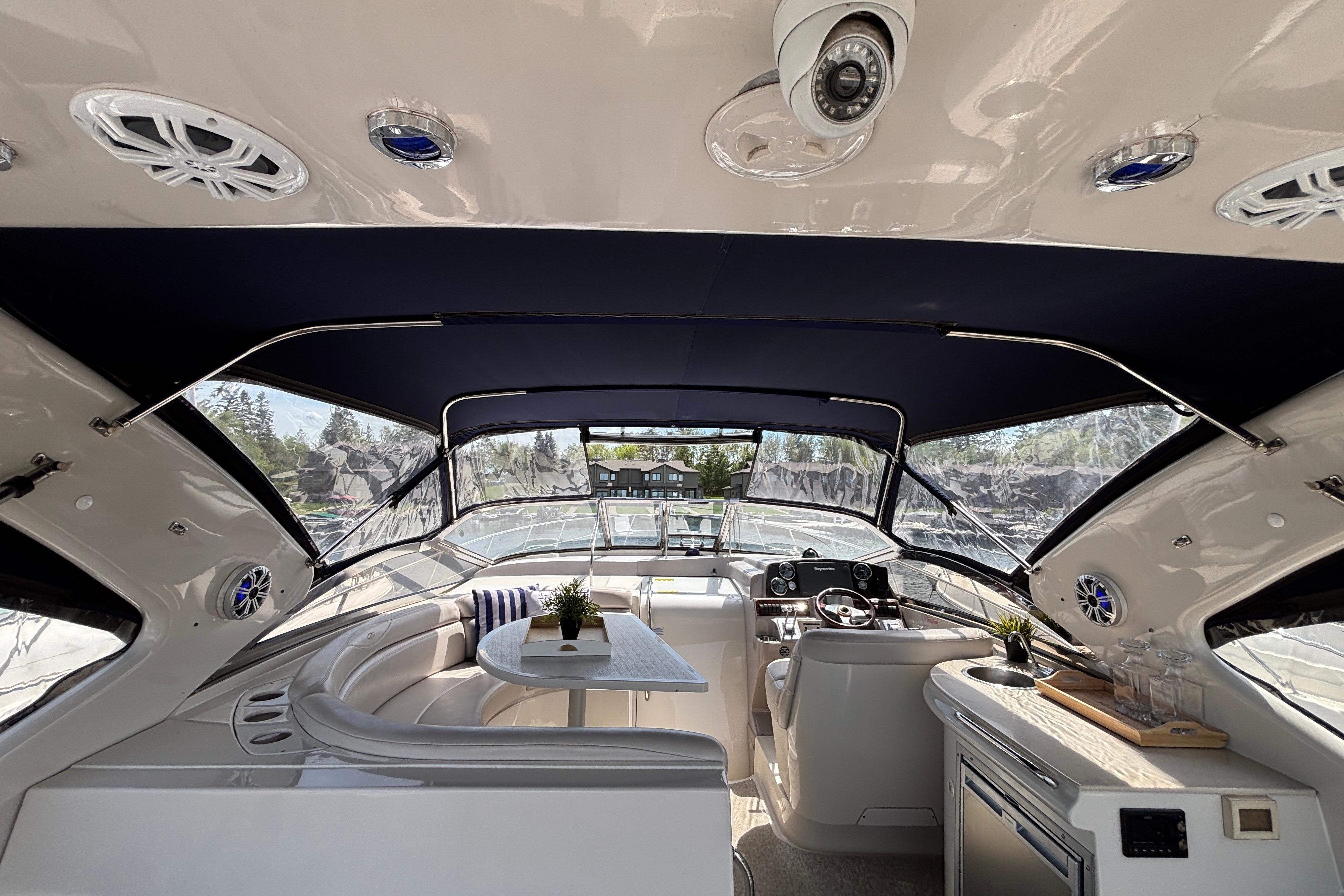 Luxurious interior of 2000 Regal Commodore 4160 yacht with seating and helm.