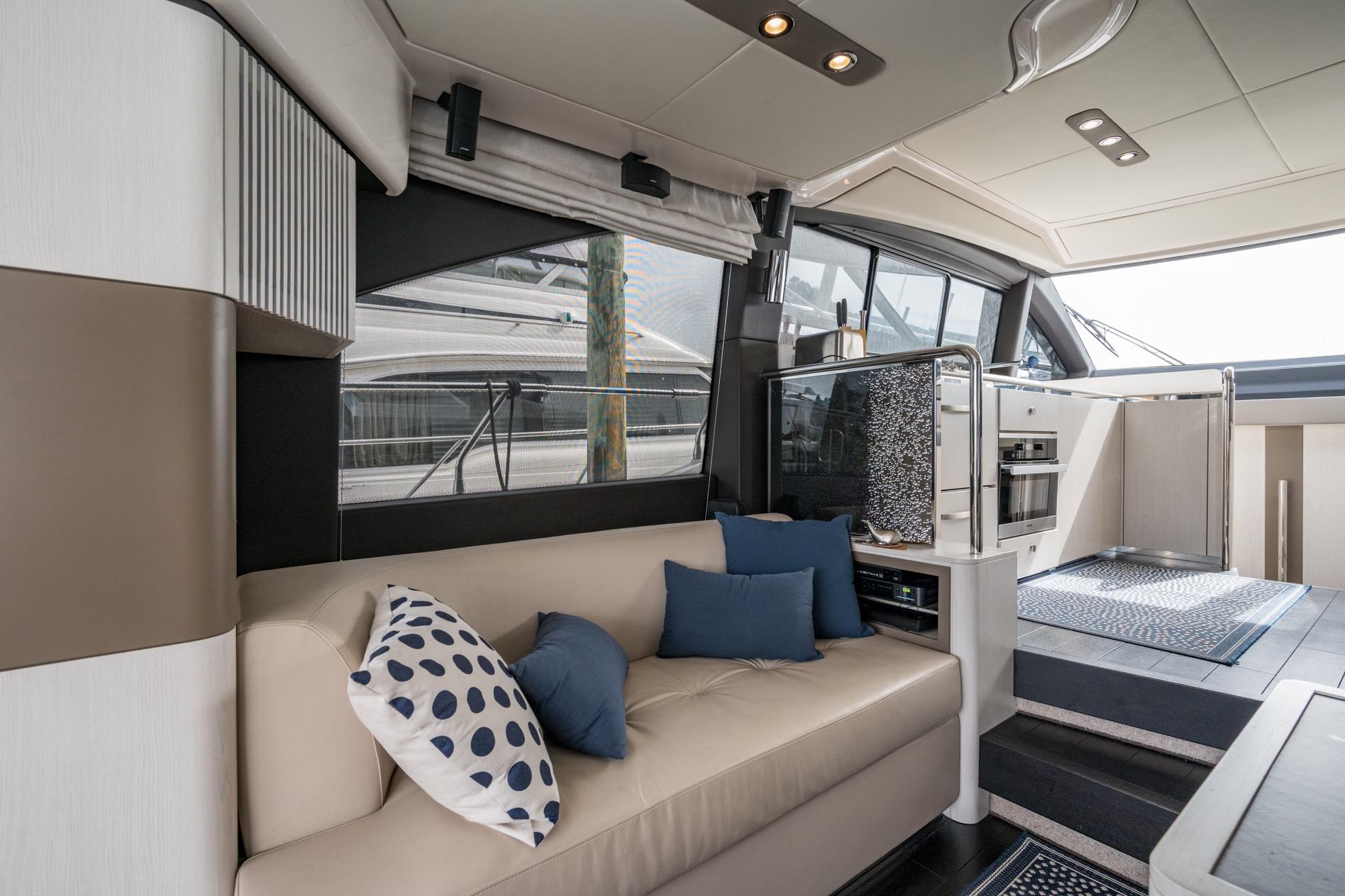 Luxurious interior of 2020 Azimut Fly 50 yacht with modern seating and elegant decor.
