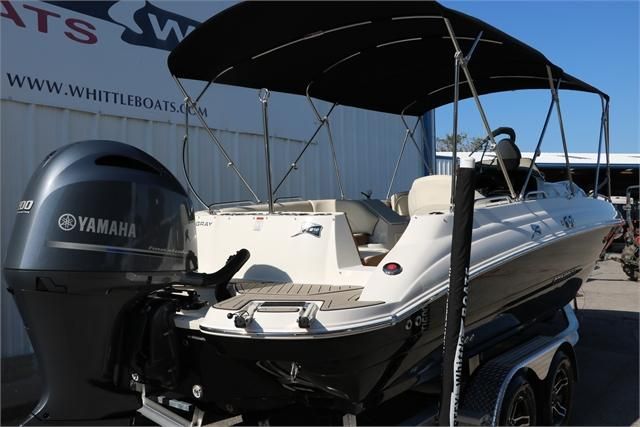 A 2022 Stingray 212 SC boat with a black sunshade and Yamaha outboard motor.