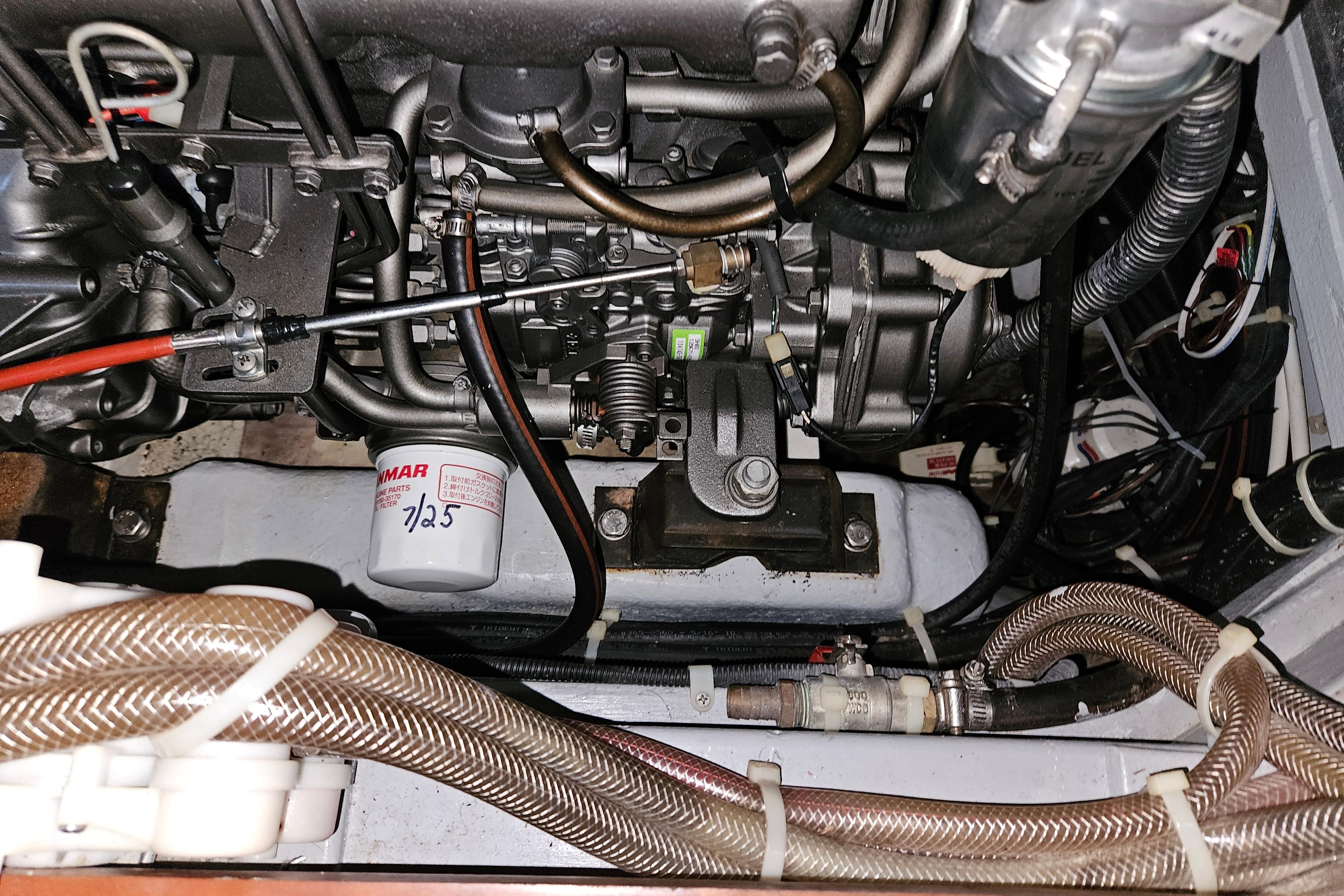 Engine compartment of a 2013 Passport 470 Center Cockpit sailboat, showing detailed components.