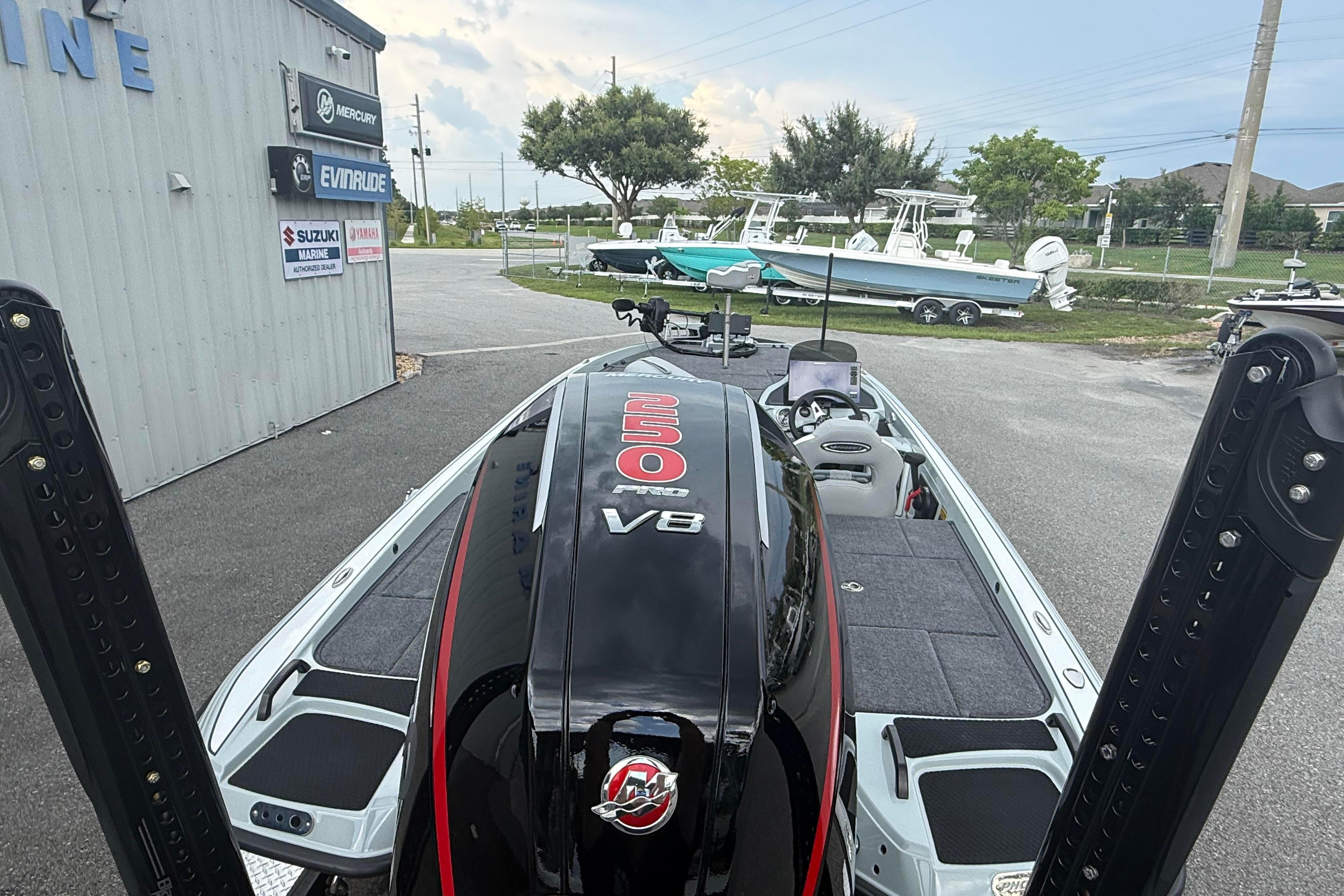 2027 Phoenix 921 Elite X II boat with V8 engine at a marine dealership.