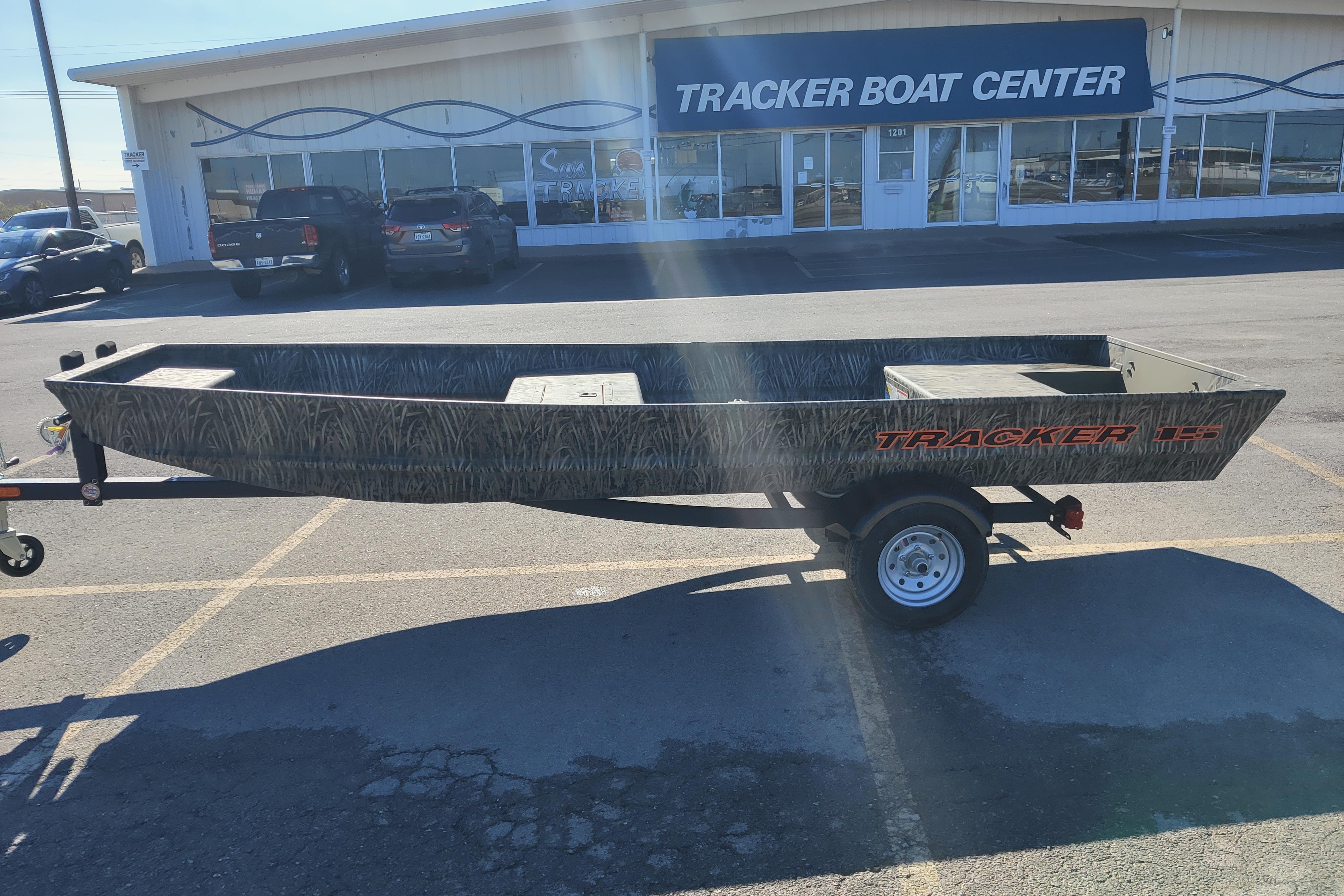 2026 Tracker Grizzly 15 Jon boat on trailer outside Tracker Boat Center.
