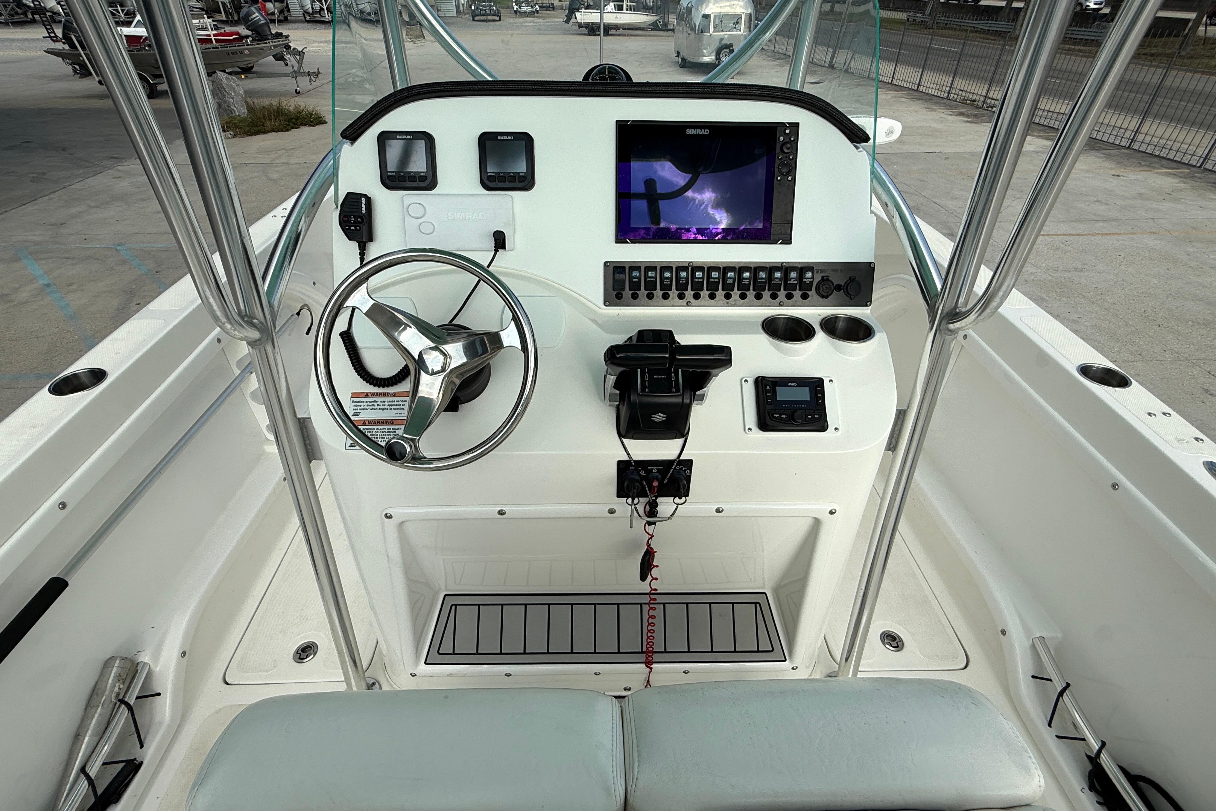 2020 Twin Vee 240 GFX CC boat console with steering wheel and navigation display.