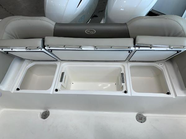 2024 Key West 263 FS boat with open storage compartments.