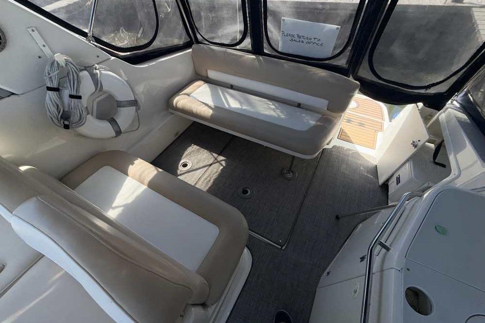 Interior of a 2001 Monterey 282 Cruiser boat with seating and life preserver.