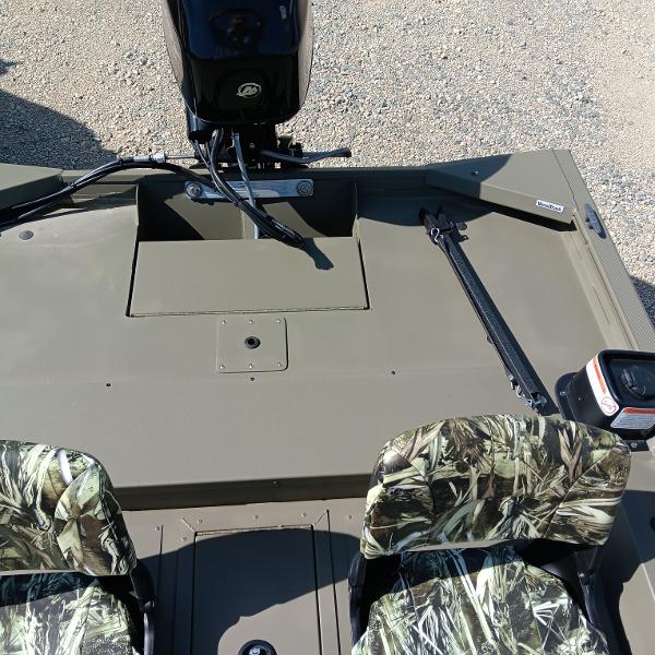 2025 Tracker Grizzly 1754 SC boat interior with camouflage seats and motor.