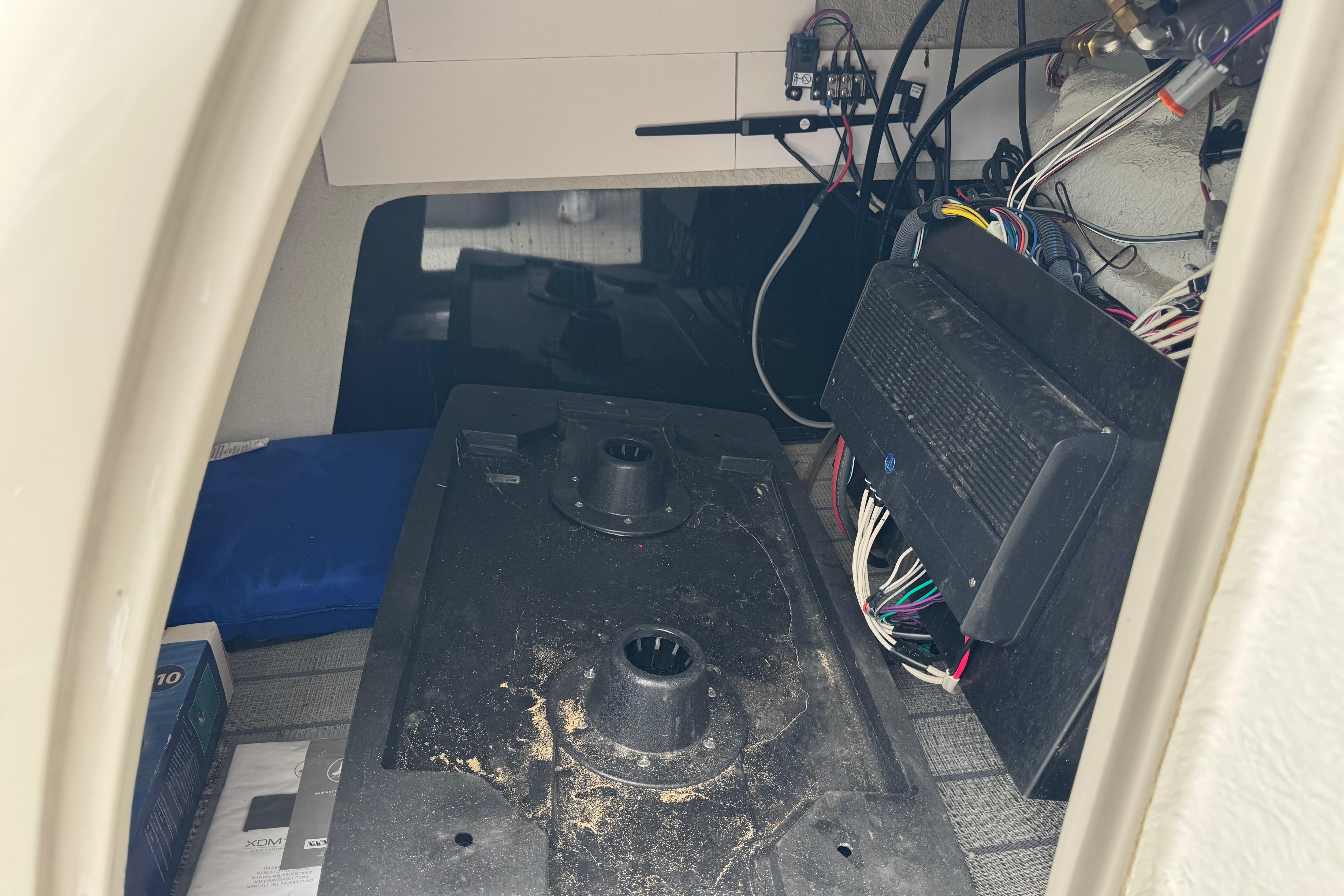 Interior view of a 2023 Starcraft MX 25 DL DH boat showing wiring and components.