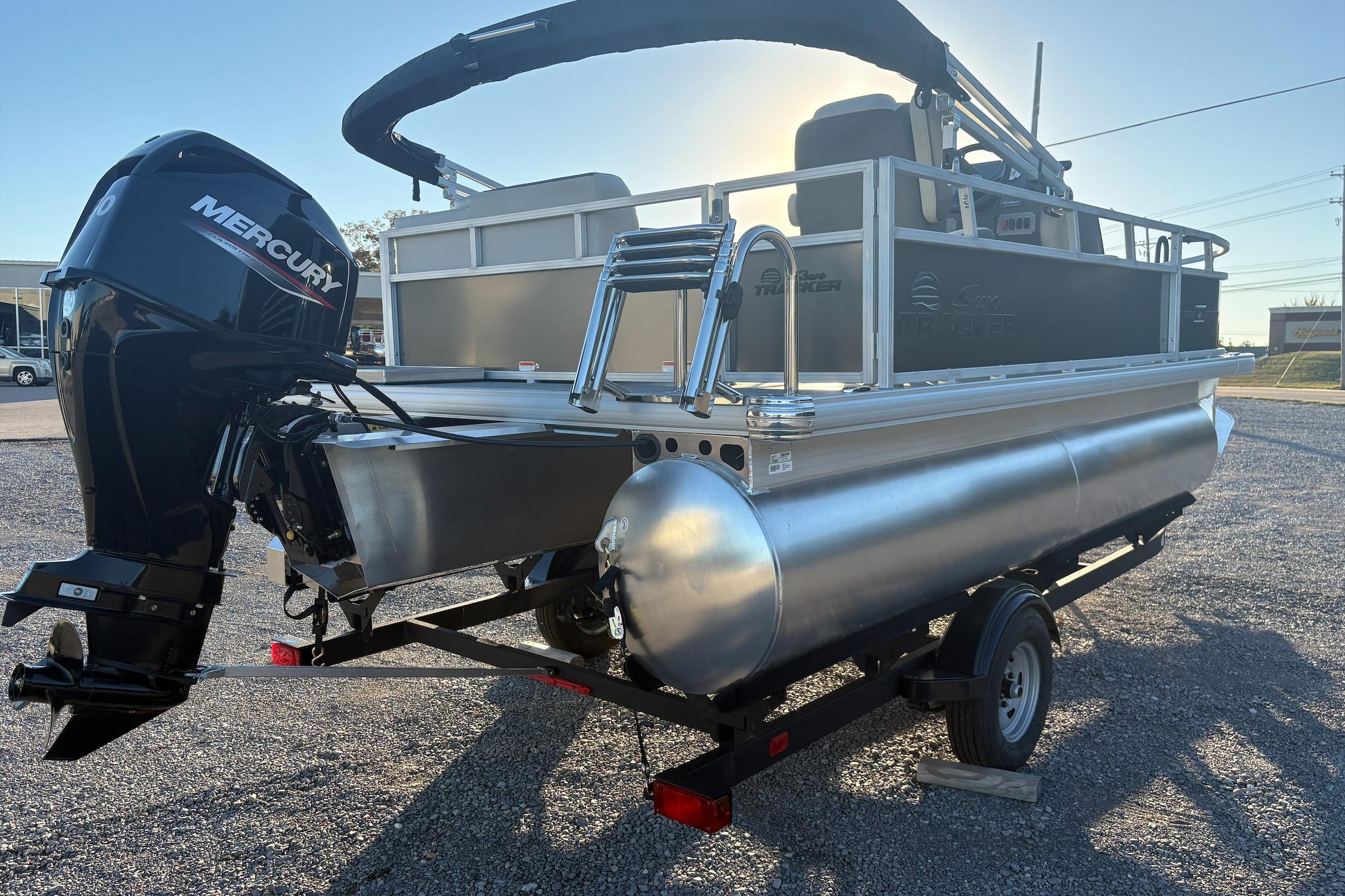2026 Sun Tracker Bass Buggy 16 XL Select pontoon boat with Mercury outboard motor.