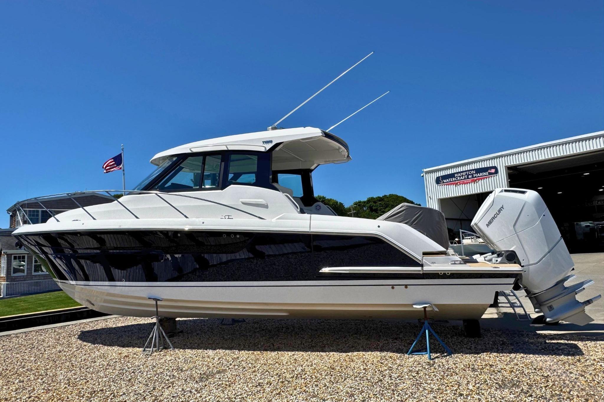 2027 Tiara Yachts 39 LE boat displayed outdoors with dual Mercury engines.