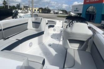2022 Hurricane SunDeck 192 OB boat interior with seating and steering console.
