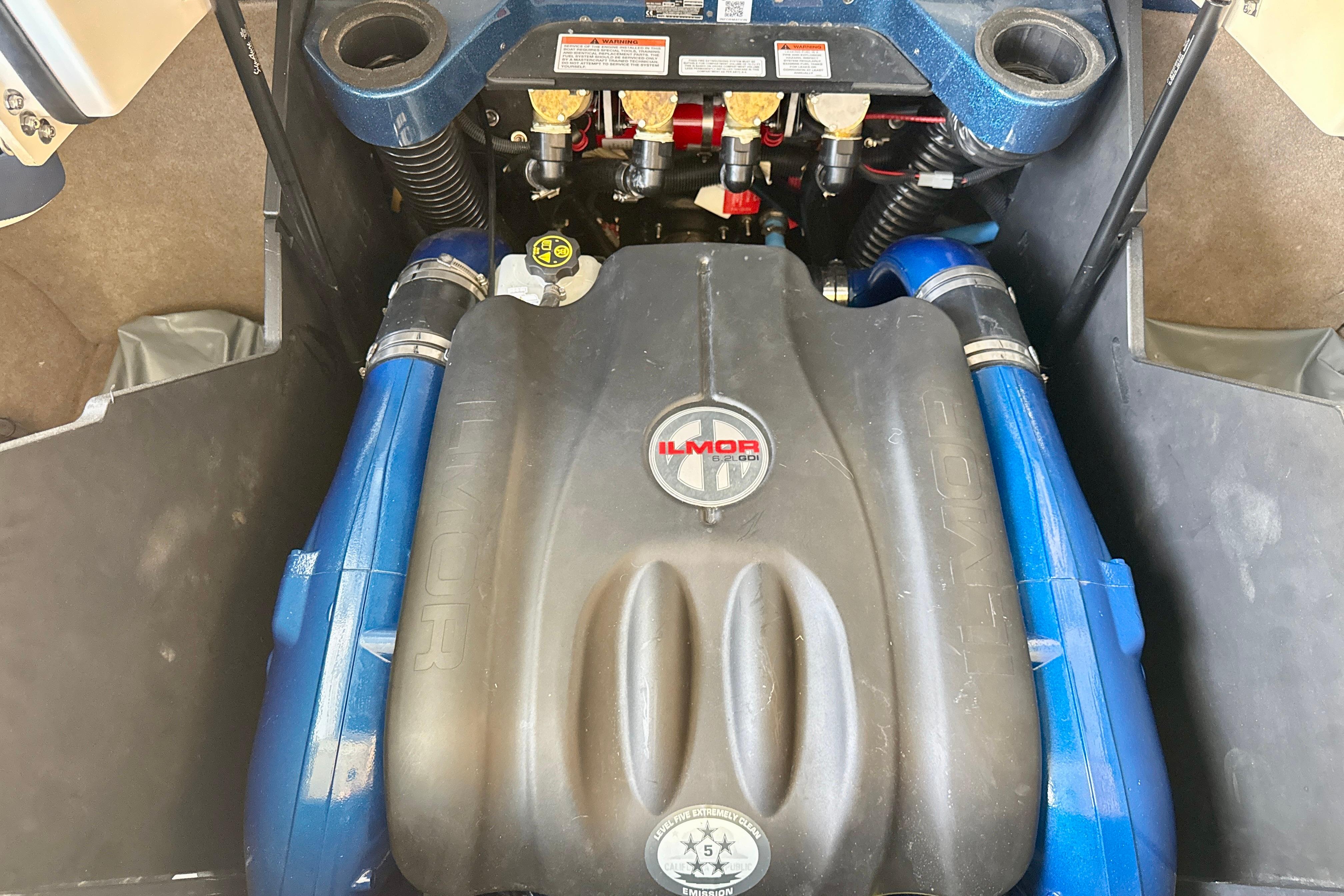 Engine compartment of a 2022 MasterCraft X24 boat featuring an Ilmor engine.