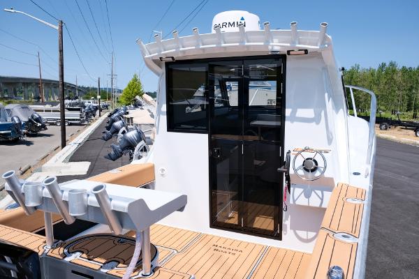 2023 Makaira Gen3 800 boat with teak deck and modern cabin design.