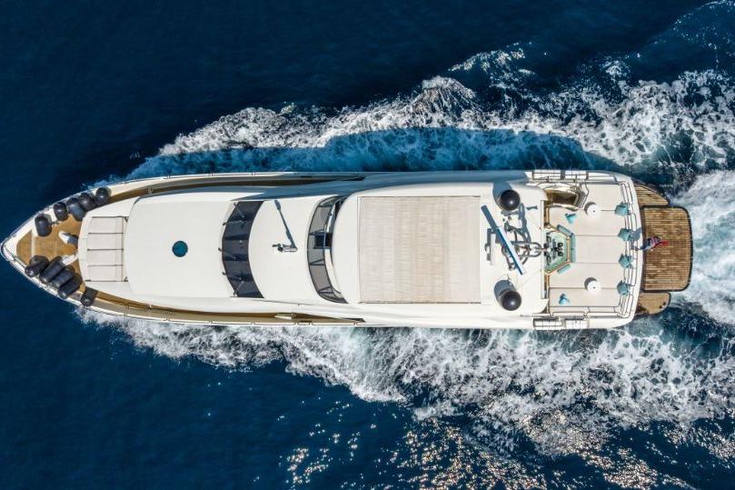 Aerial view of 2009 Sunseeker 34 Metre Yacht cruising on open water.