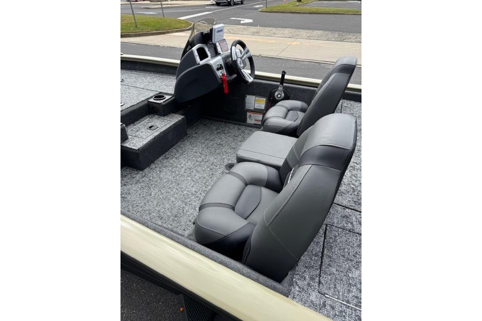 2026 Tracker Pro Team 190 boat interior with gray seating and steering console.