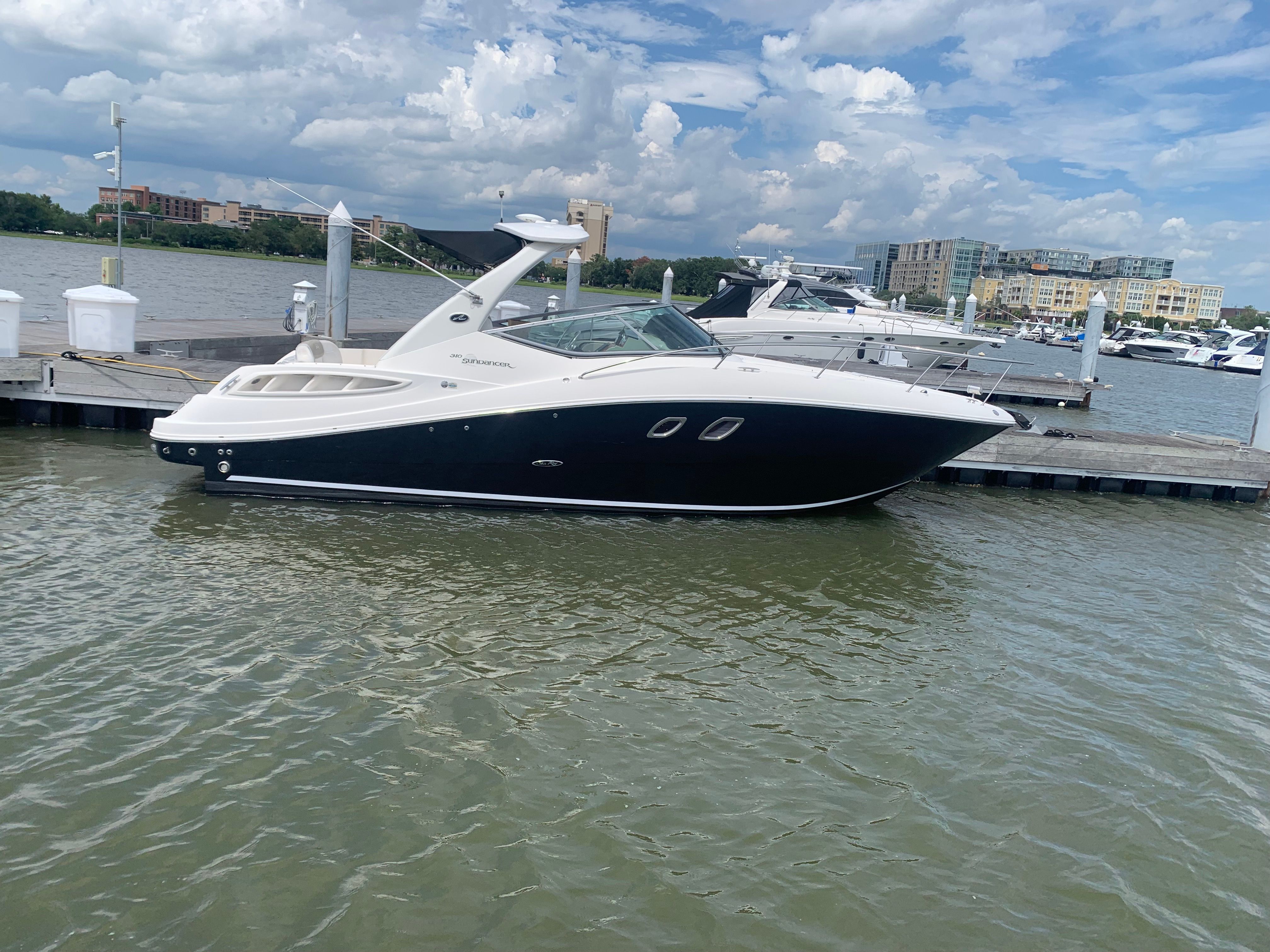 2007 Sea Ray Sundancer 310 docked on a sunny day.