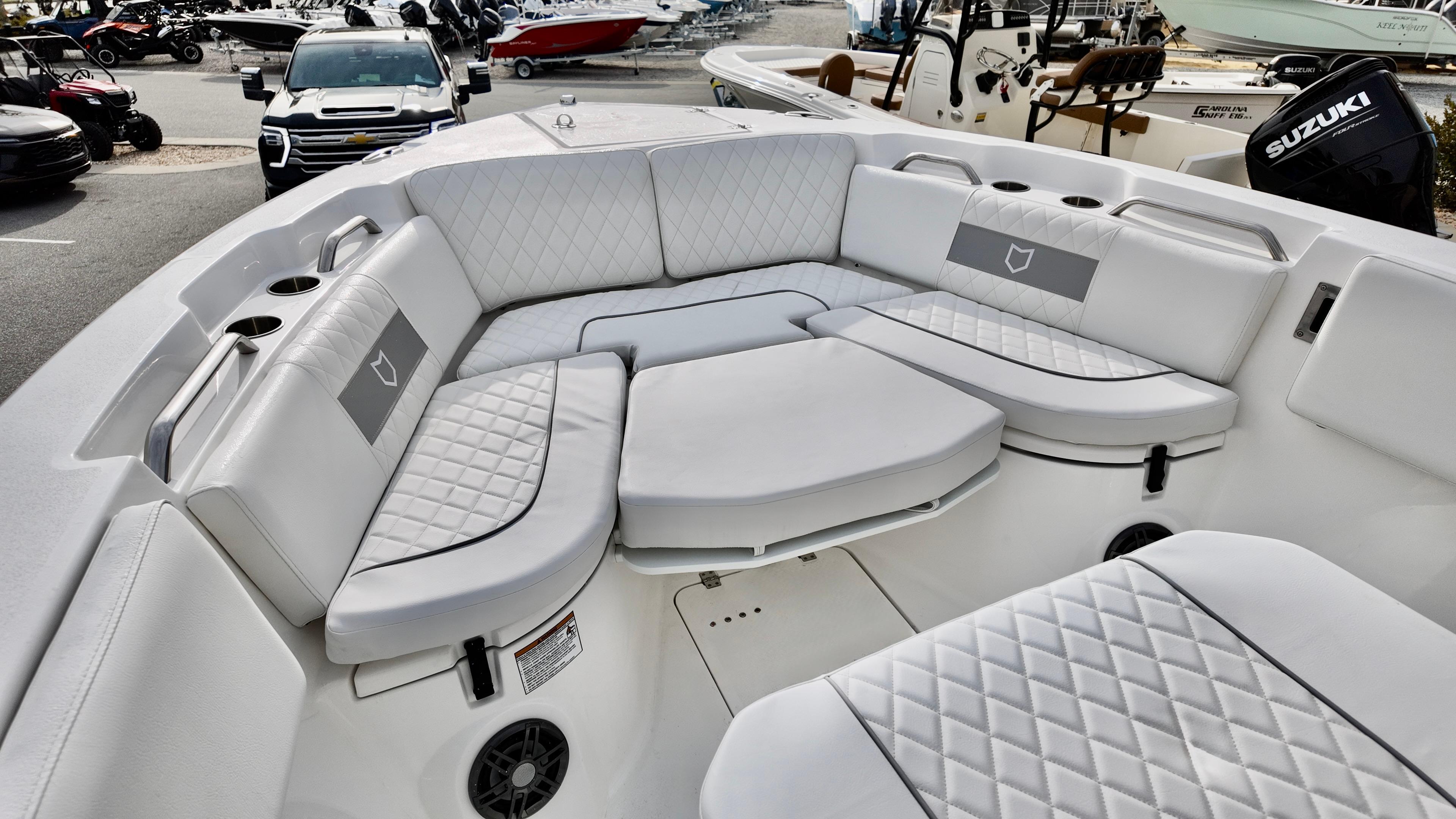 Luxurious seating area on 2025 Sea Fox 268 Commander boat, featuring quilted upholstery.