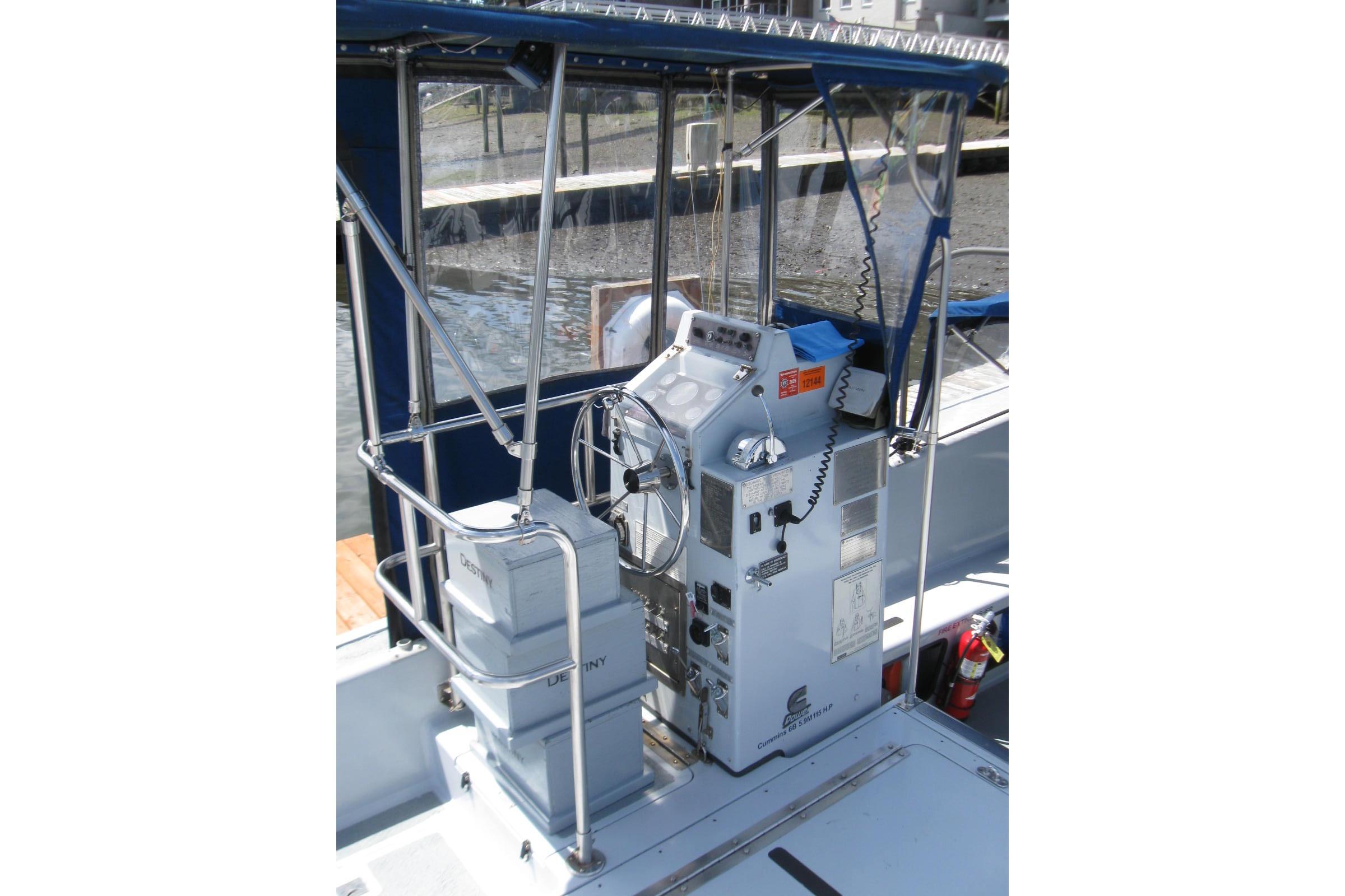 Control console of a 1994 Willard US Navy boat with protective canopy.