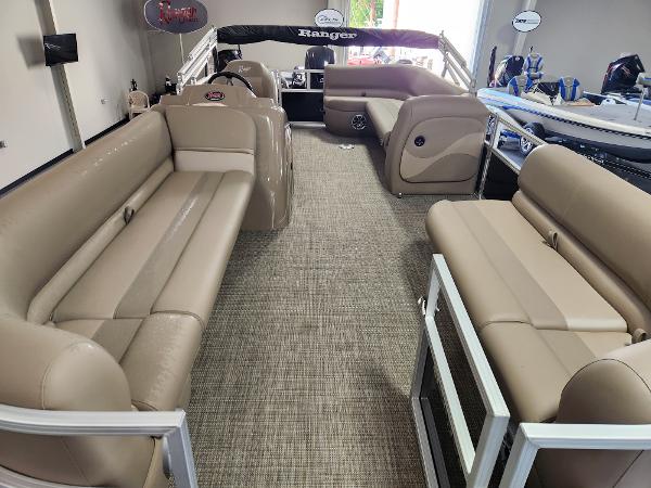 2025 Ranger 200C pontoon boat interior with beige seating and spacious layout.