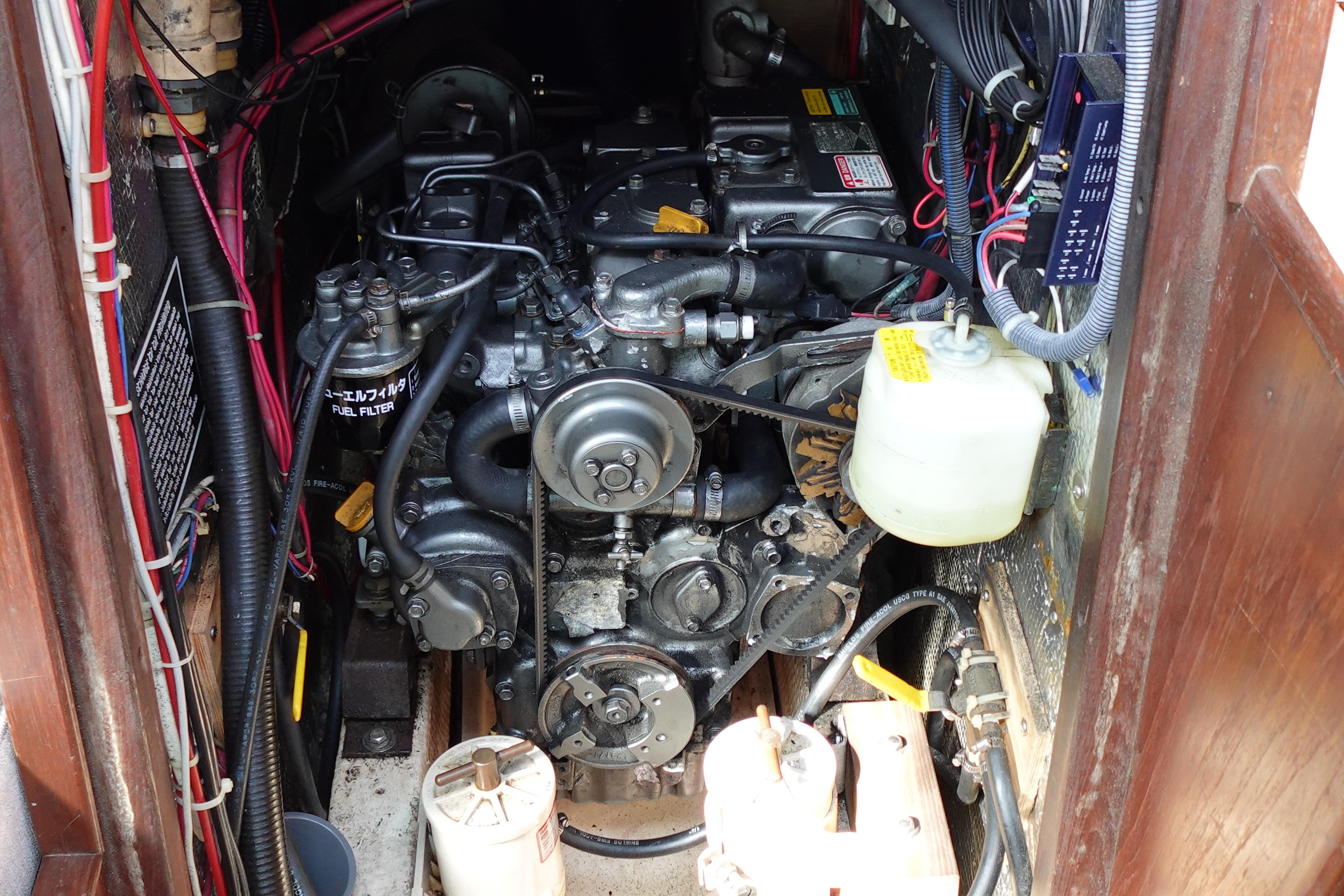 Engine compartment of a 1978 Morgan 382 sailboat, showcasing detailed mechanical components.