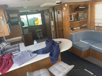 Interior of a 1993 Gibson Sport Series with kitchen and seating area.