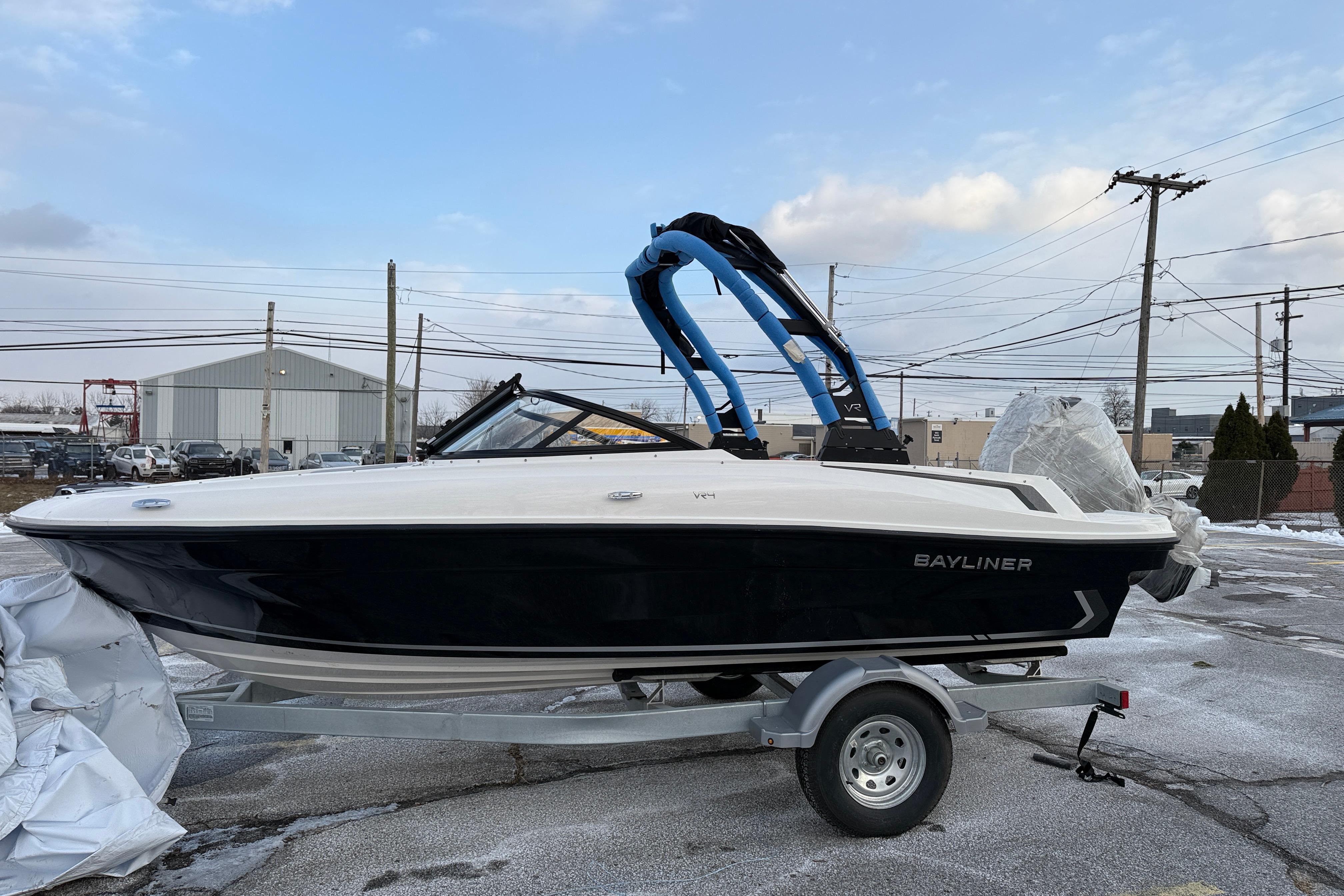 2026 Bayliner VR4 Bowrider OB on trailer, parked outdoors.