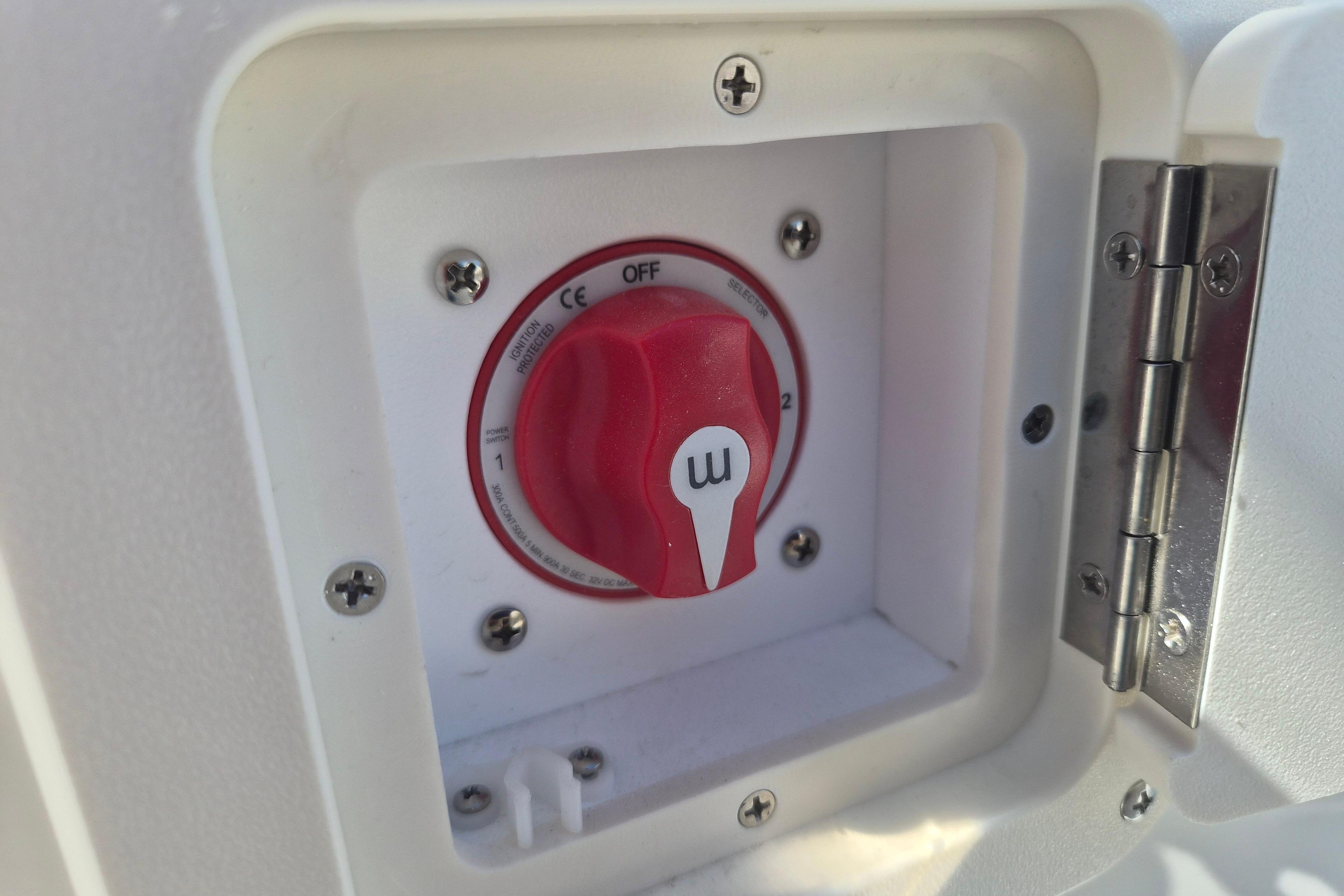 Battery switch on a 2026 Key West 239 FS boat, featuring a red dial.