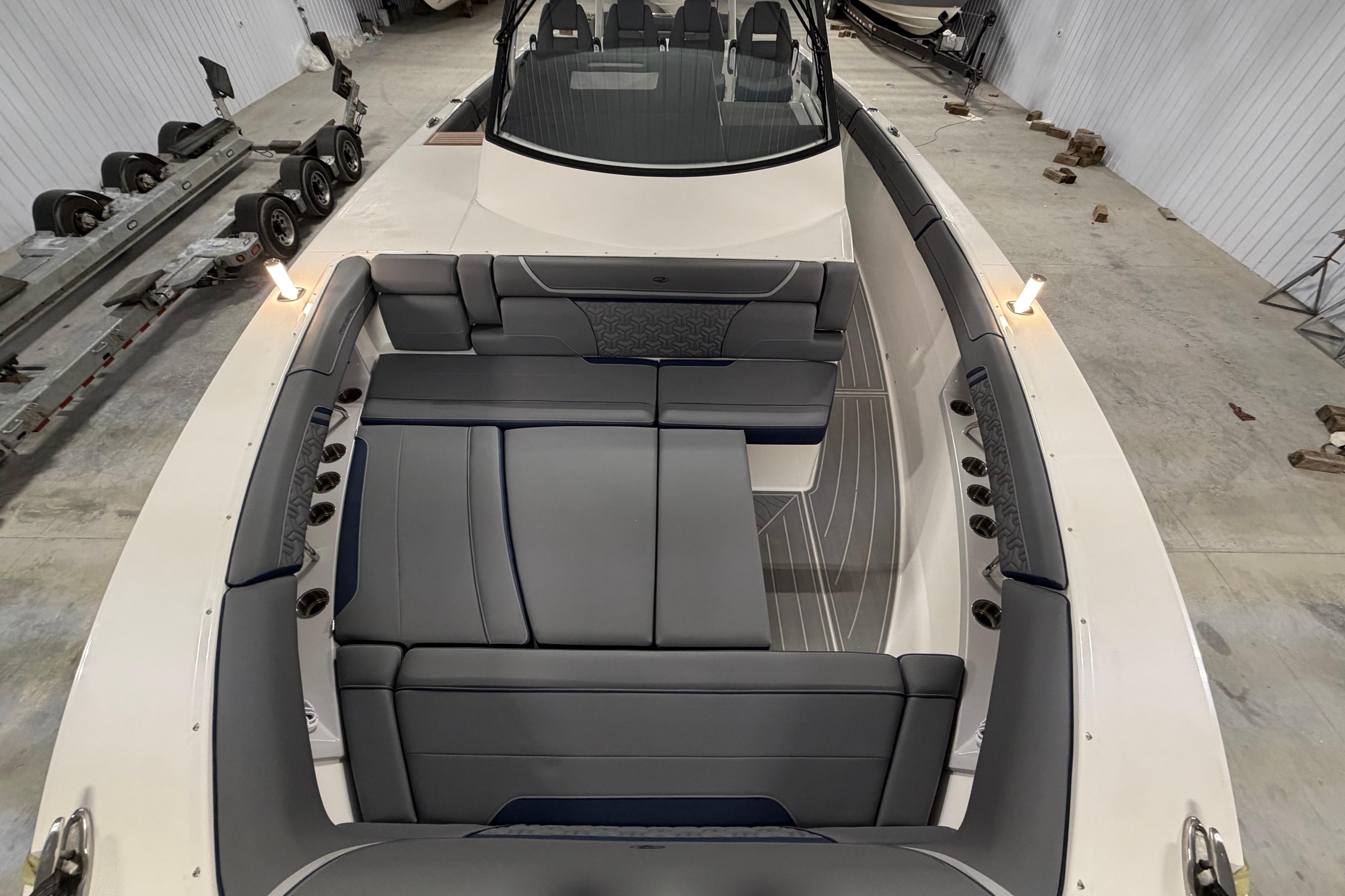 2027 Regal 38 Surf boat interior with luxurious seating in a spacious cabin.