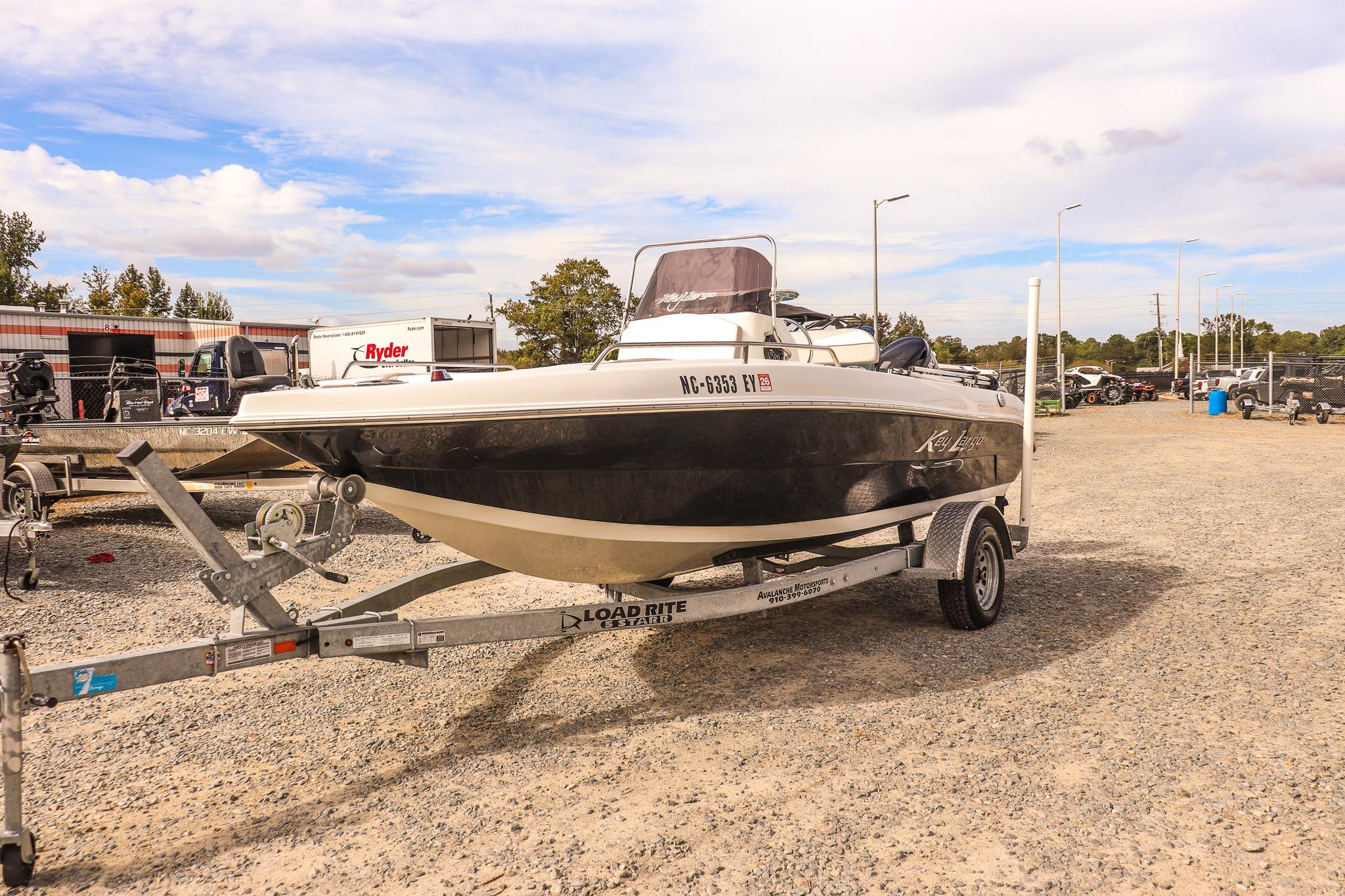 2020 Key Largo 1800 Center Console boat on trailer in outdoor lot.