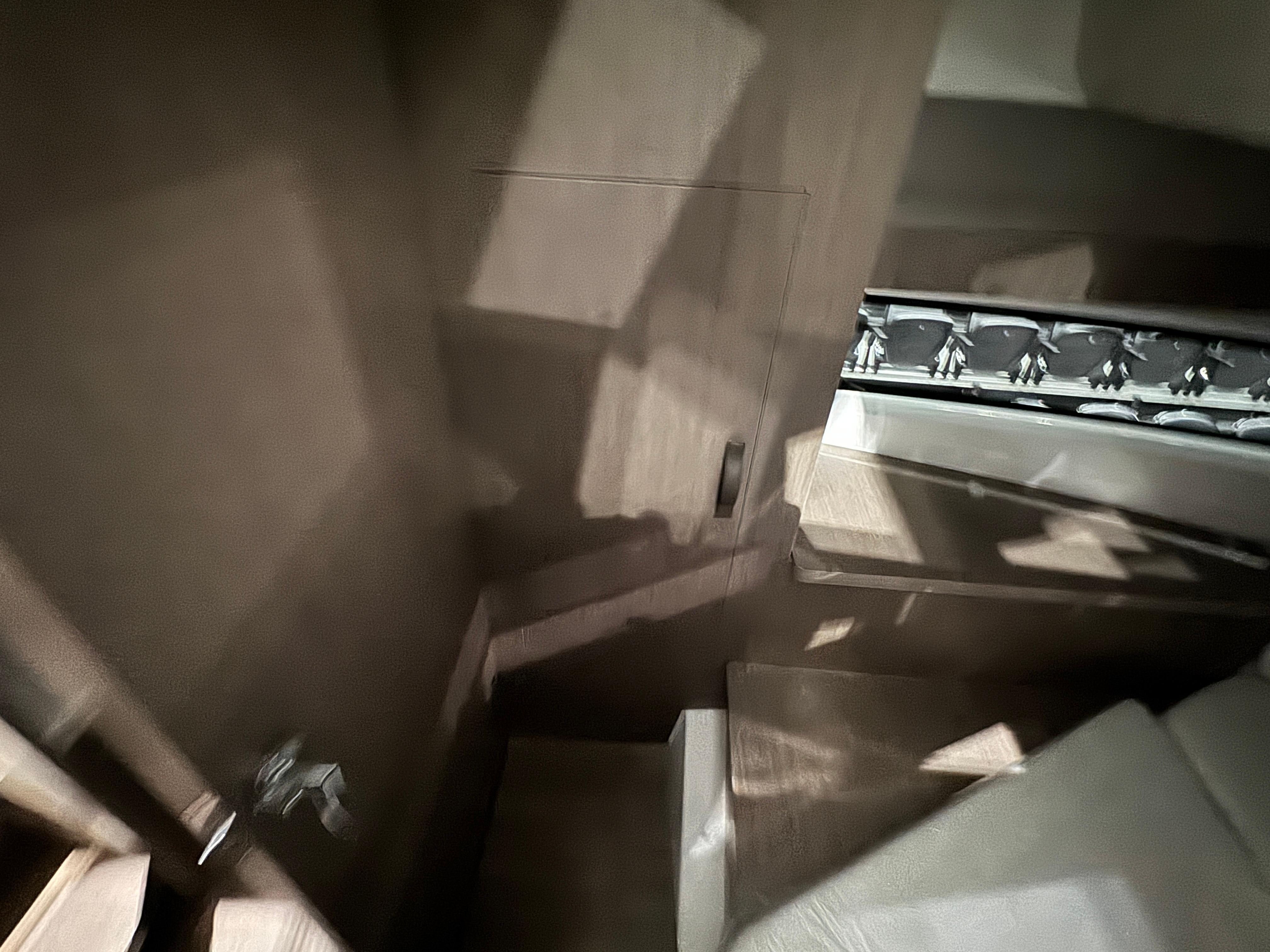 Interior view of 2025 Jeanneau NC 895 Sport Series 2, featuring wooden stairs and modern design.