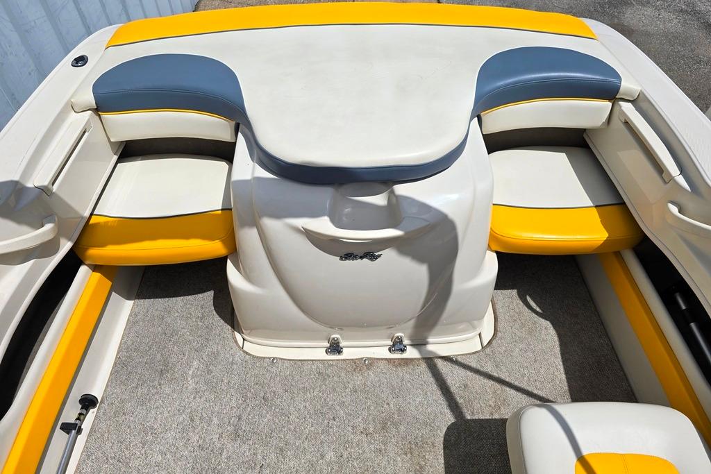 2007 Sea Ray 205 Sport boat interior with yellow and blue seating.